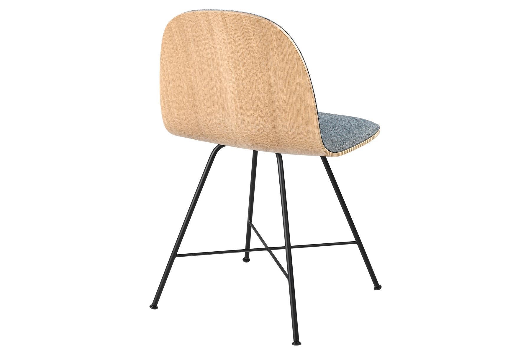 The GUBI 2D Chair is a series of light dining chairs made from laminated veneer with options for front upholstery in a wide range of fabrics and leathers, suitable for both private and public spaces. Being an extension to the classic GUBI 3D Chair,