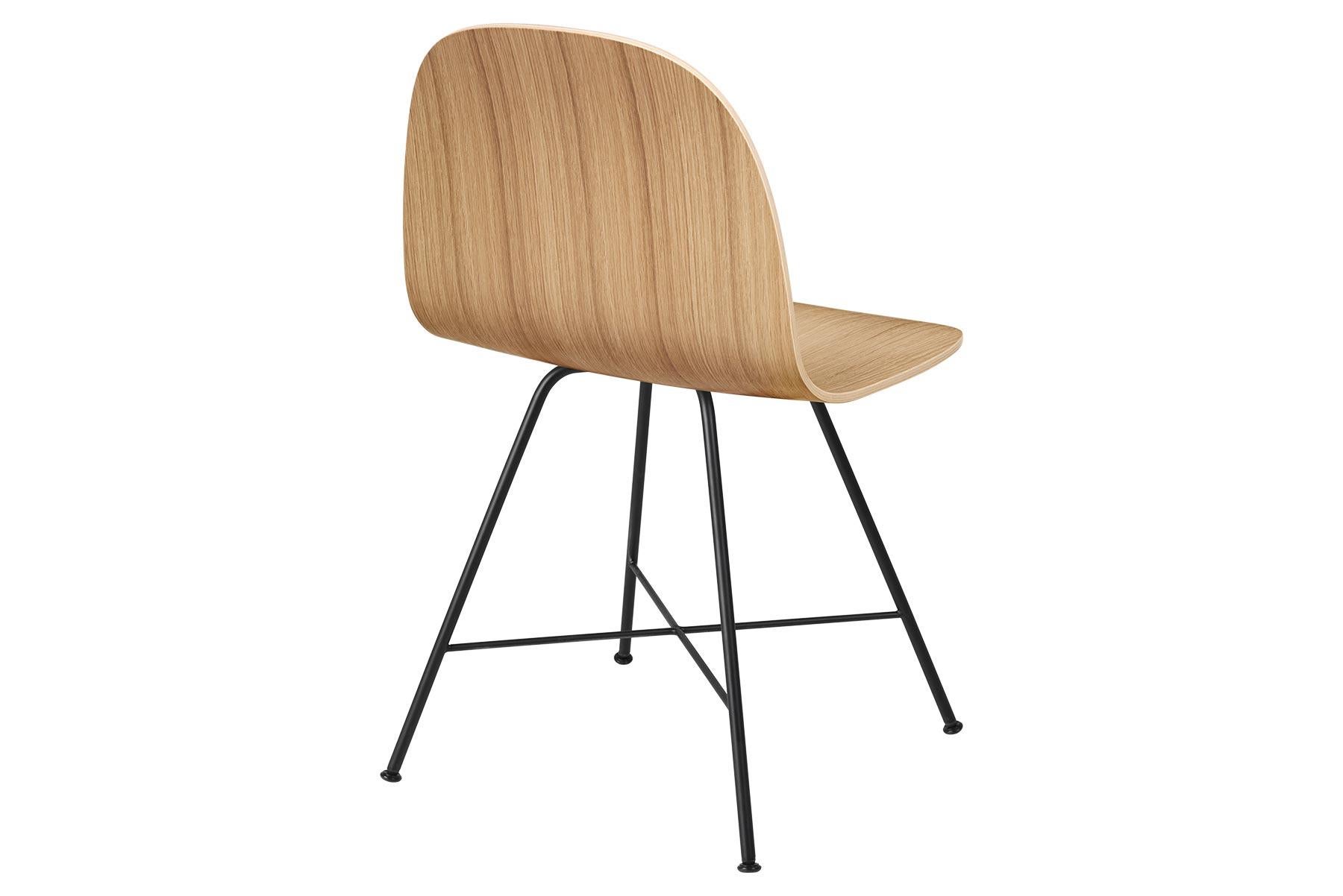 The Gubi 2D chair is a series of light dining chairs made from laminated veneer with options for front upholstery in a wide range of fabrics and leathers, suitable for both private and public spaces. Being an extension to the classic Gubi 3D chair,