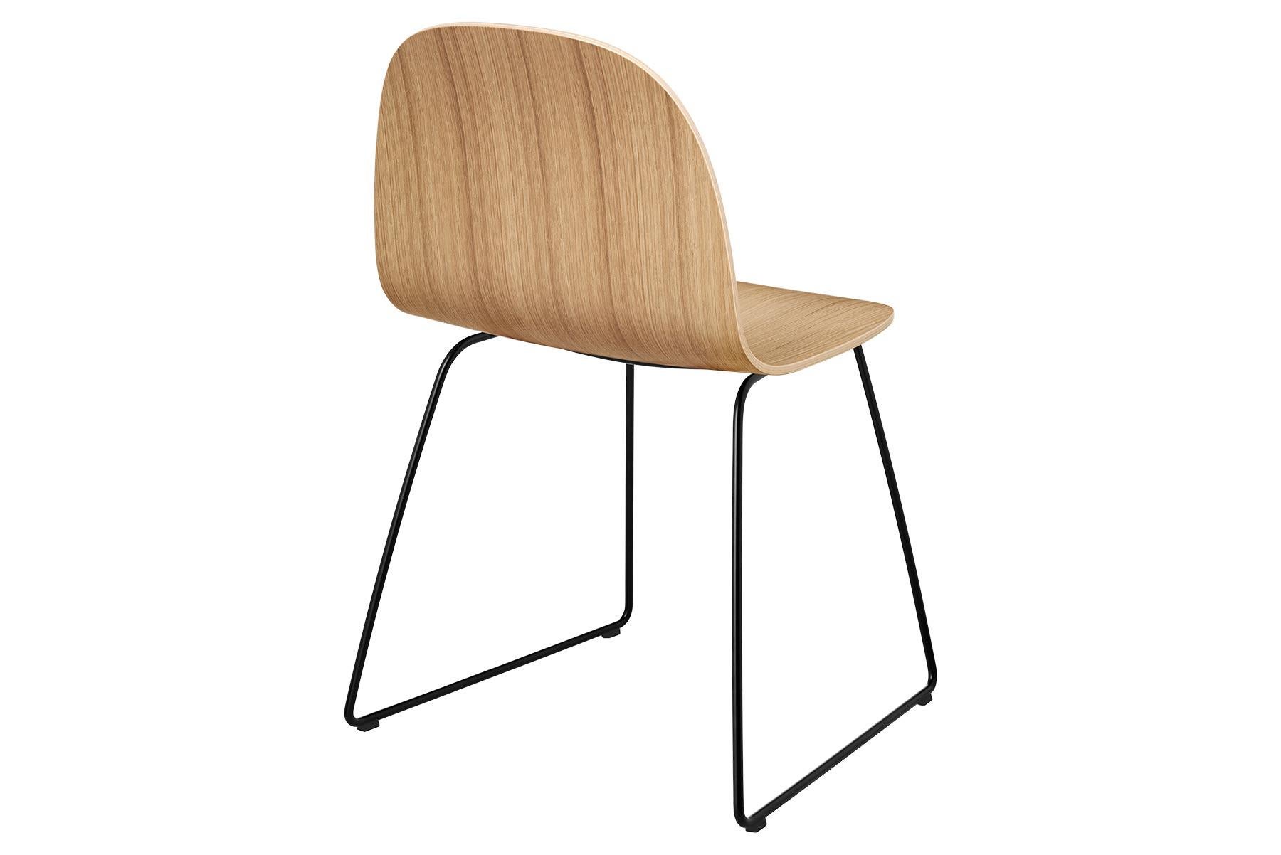 The Gubi 2D chair is a series of light dining chairs made from laminated veneer with options for front upholstery in a wide range of fabrics and leathers, suitable for both private and public spaces. Being an extension to the Classic Gubi 3D chair,