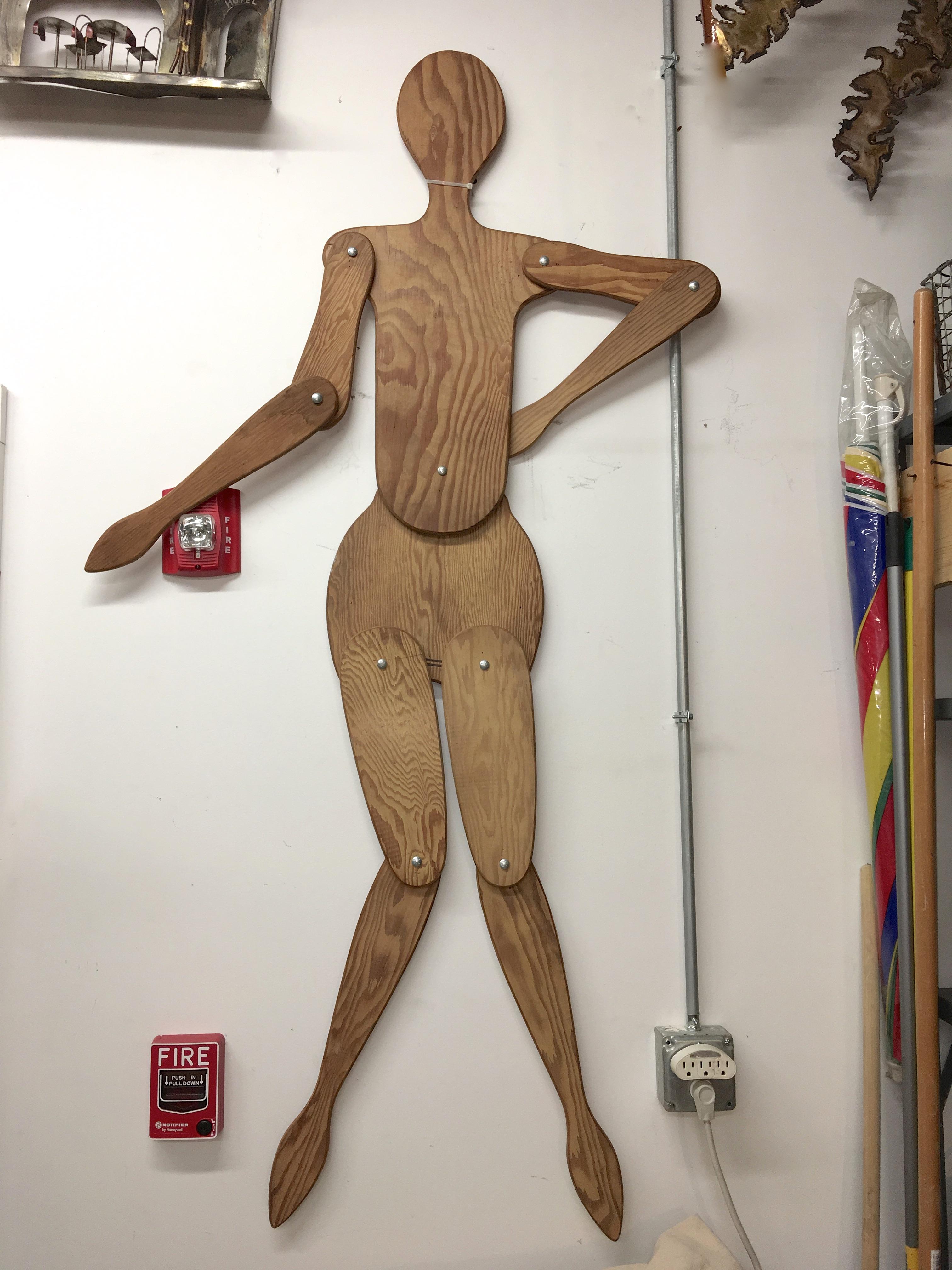 Peculiar Folk Art two-dimensional marionette or mannequin comprised of ten elements of cutout half inch plywood, connected with bolts and wing nuts, permitting the limbs to be moved in multiple positions. Possibly a tribute to Mario Ceroli.