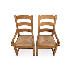 Lot de 2 fauteuils avec accoudoirs en chêne, style rustique français, avec assise en osier tressé