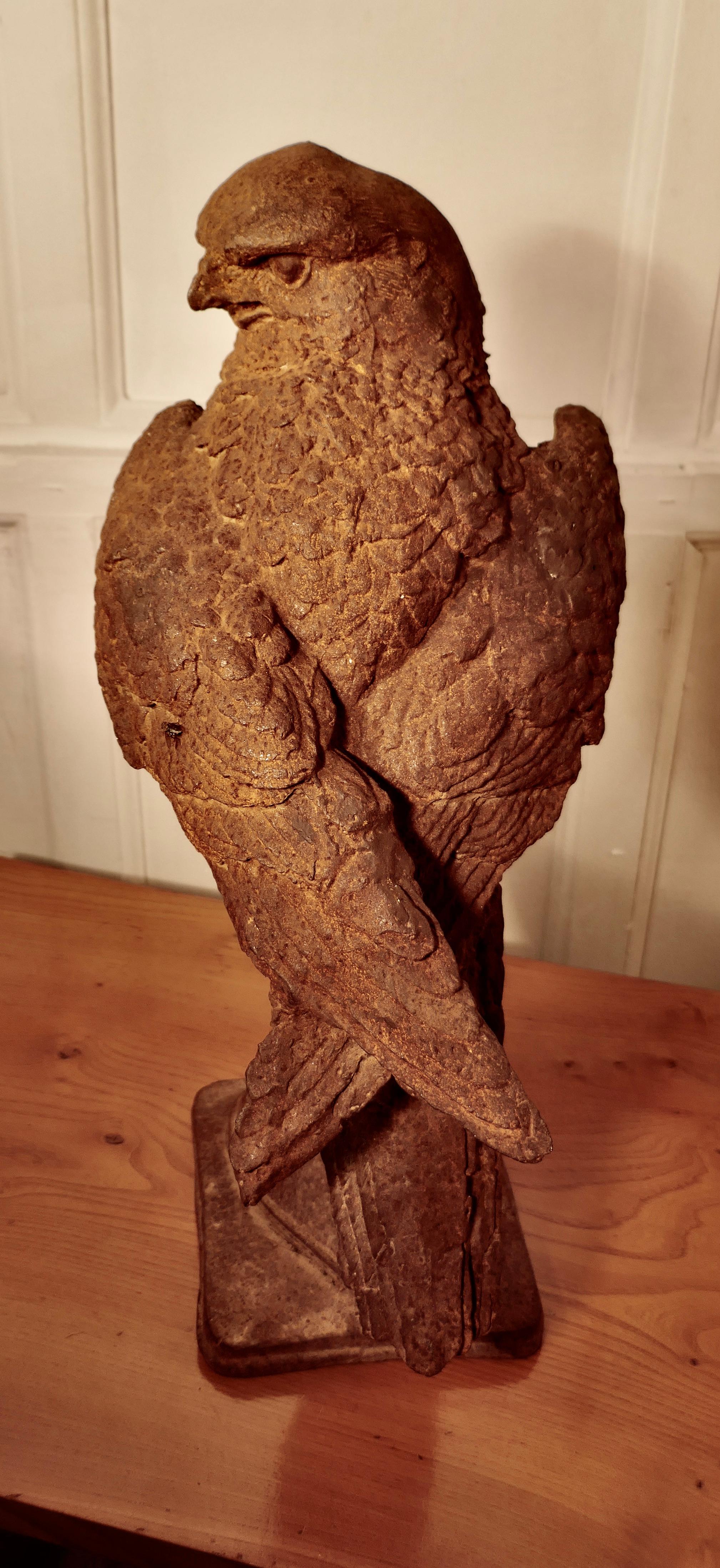 Folk Art Weathered Cast Iron Statue of a Falcon on a Gloved Hand For Sale