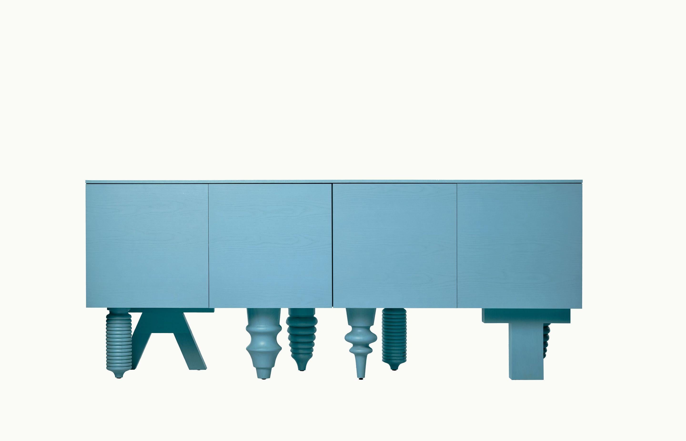 2M Multileg Cabinet in Blue Ash by Jaime Hayon for BD Barcelona

It can be uniquely configured with twelve elaborate leg options, customisable finishes and colours, and a multitude of interior storage variations. The Multileg is disciplined and
