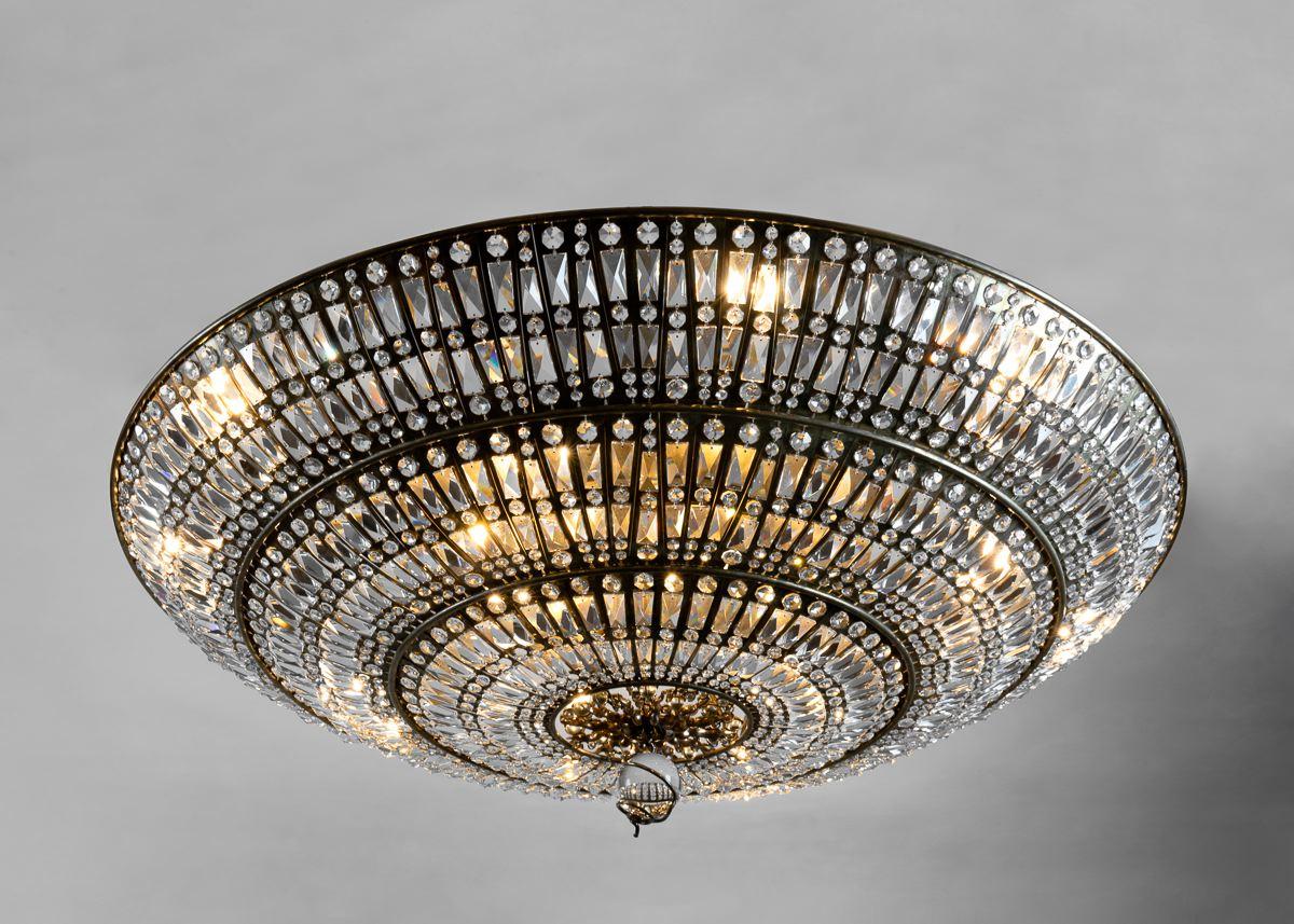 This is the 2nd Installment for Mindy. Libertine is a grand, crystal chandelier, arranged on a brooding, brass plated frame of steel. Like much of Brazier-Jones' work, the piece focuses on repeating, naturally imperfect, patterns, and elicits dark
