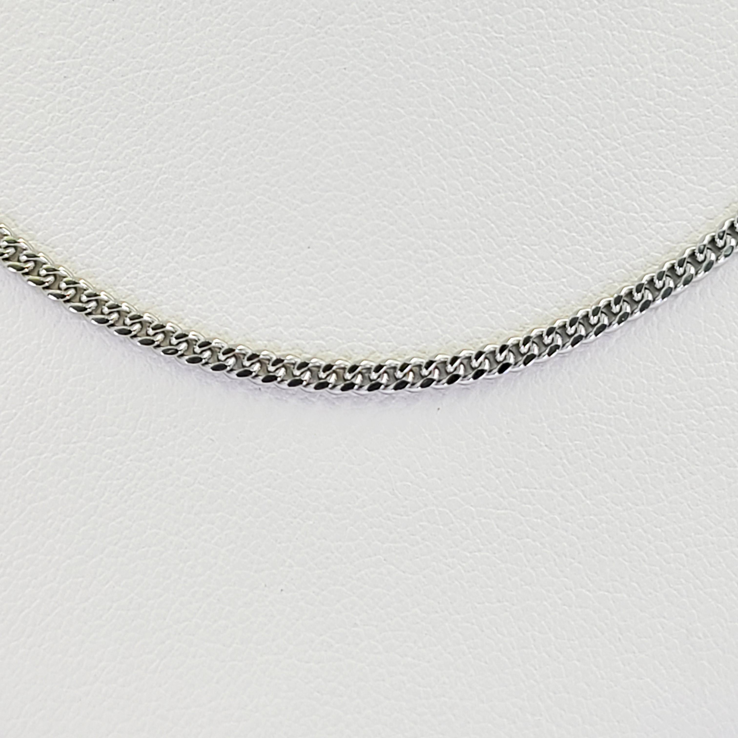 14 Karat White Gold 2mm Curb Link Chain Measuring 20 Inches Long With Lobster Clasp. Finished Weight Is 7.5 Grams.