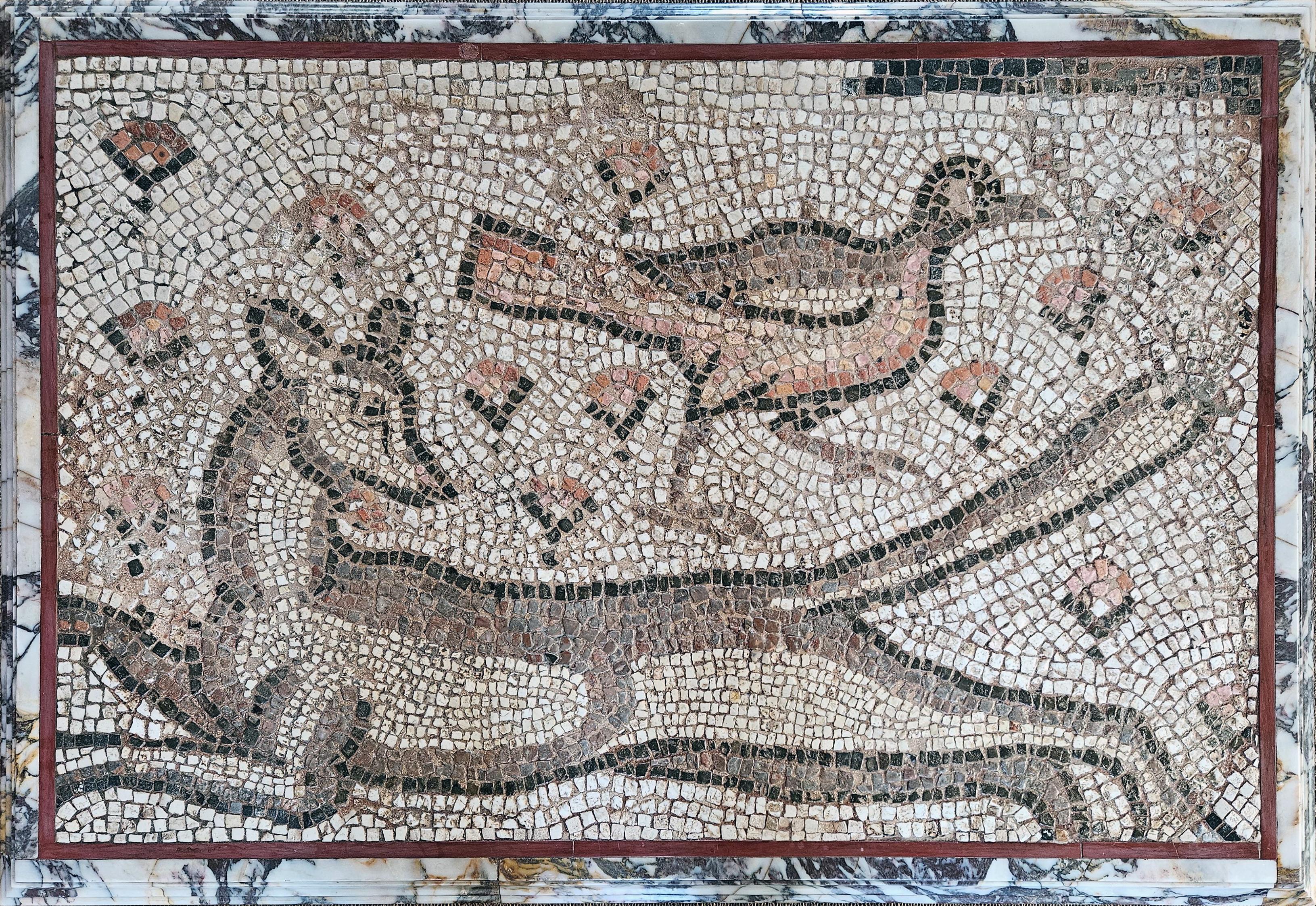 Mosaic depicting two animals (a dog and a hen) mounted as table.

Near East (Apamea?), 2nd century AD, Roman Period
Marble moulding added in 2015

Provenance : Galerie Rive Gauche, Baron F. Rolin ; exposition 