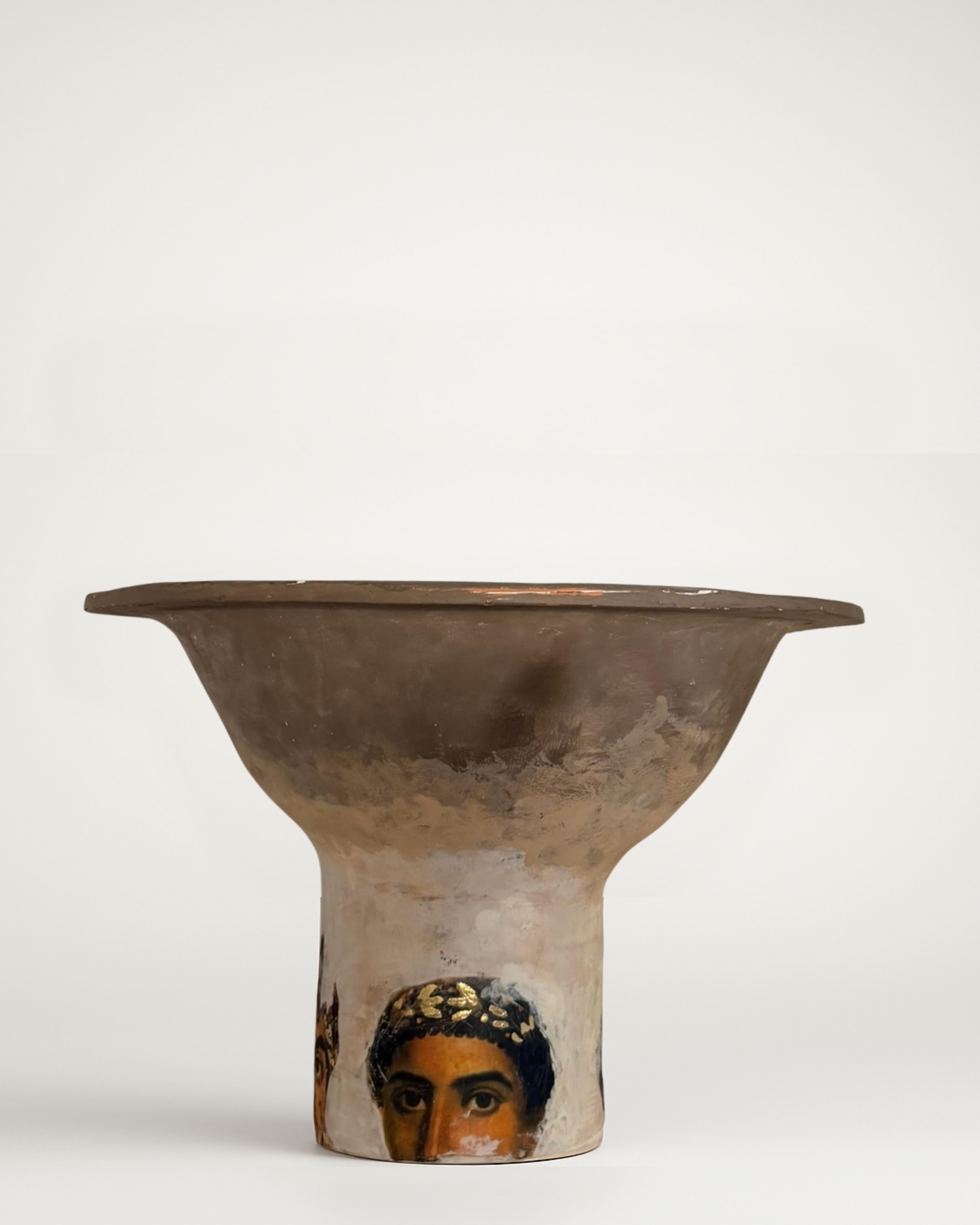 This vessel channels the quiet drama of the Mediterranean world in the 2nd century AD, shaped with a broad, flared mouth that feels both architectural and ceremonial. The form moves from a wide, weathered upper body into a tapered base, creating a