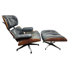 Sedia da salotto Eames in palissandro di seconda generazione e ottomana Herman Miller, USA 1960