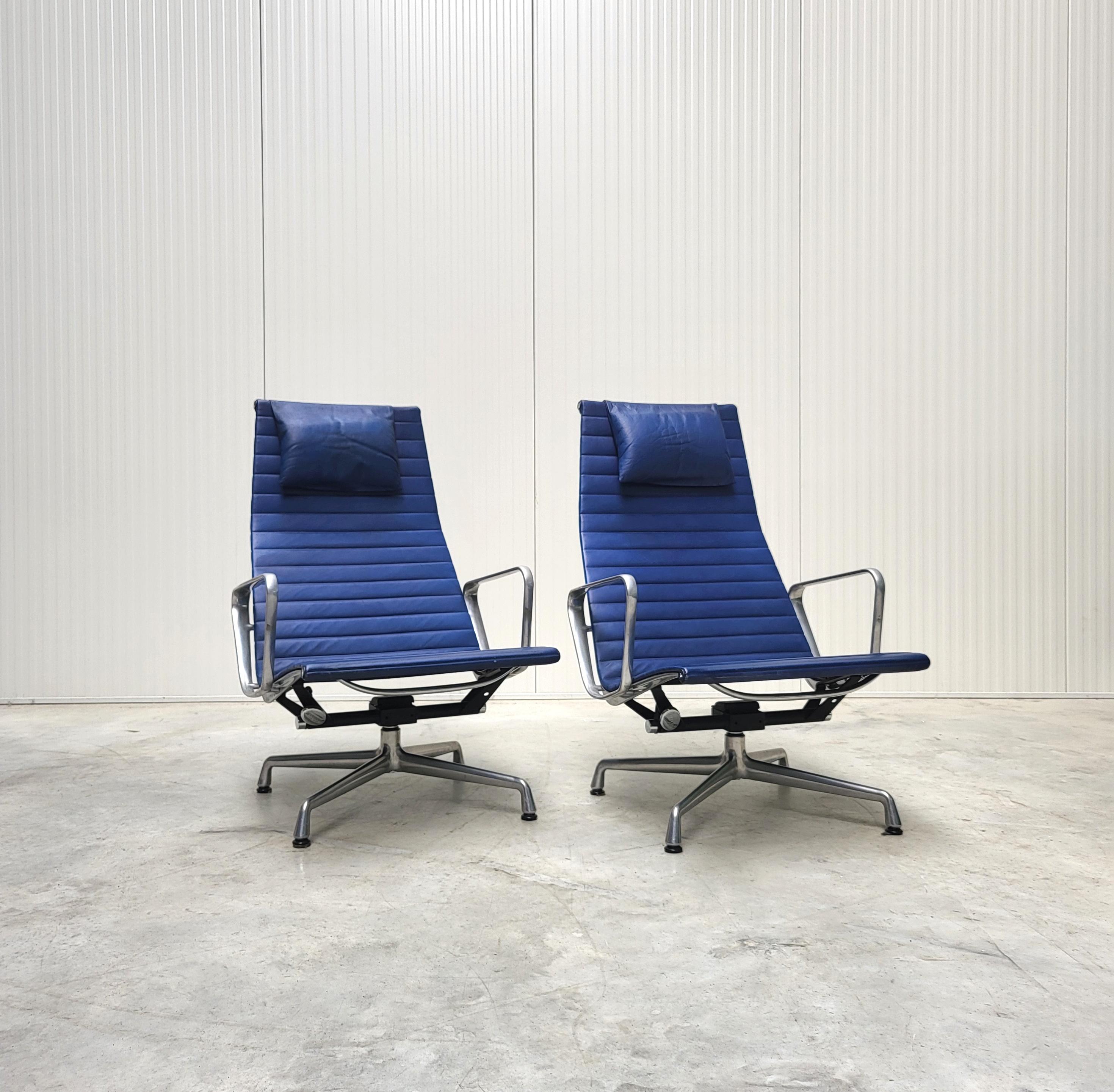 Pair of very nice lounge chairs model EA124 produced by Vitra and designed by Charles Eames. 
The chairs features a polished aluminium frame and were made in the 90s.

The chairs features a tilt mechanism which works very smoothly.

It has a