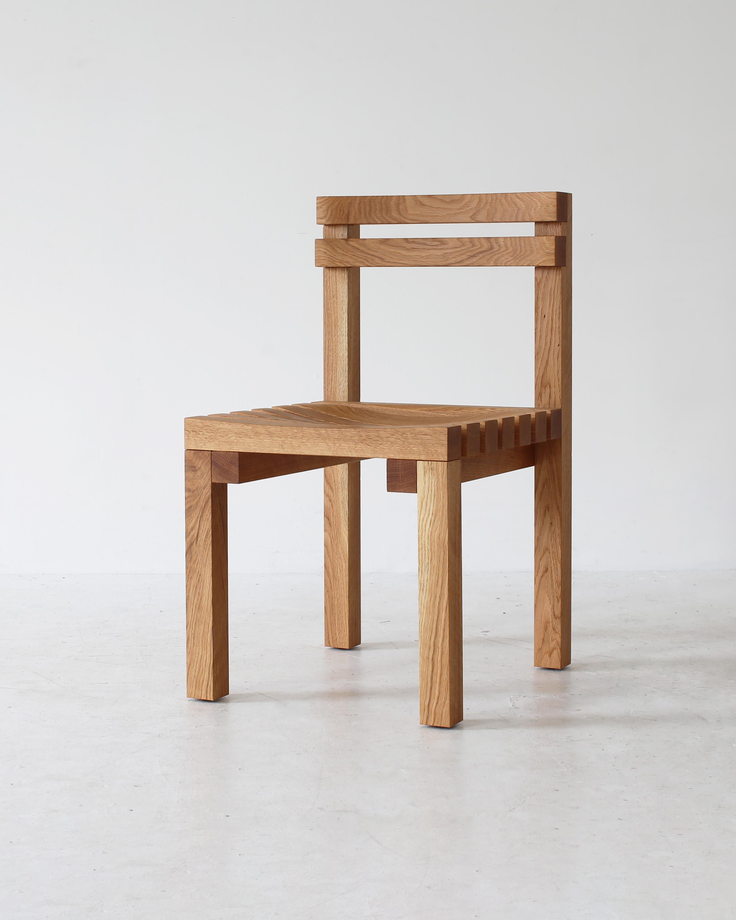 2x2 Chair is made entirely of 2-inch by 2-inch wood members, carved on a CNC mill, and assembled into a minimal, yet comfortable chair. Available in oak, maple, or sapele with a hand-rubbed oil finish.