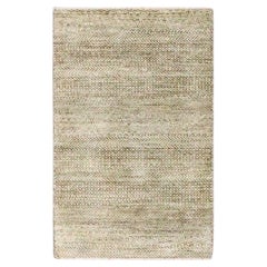 Tappeto marrone con design moderno dell
erba, in lana naturale non colorata e annodata a mano.