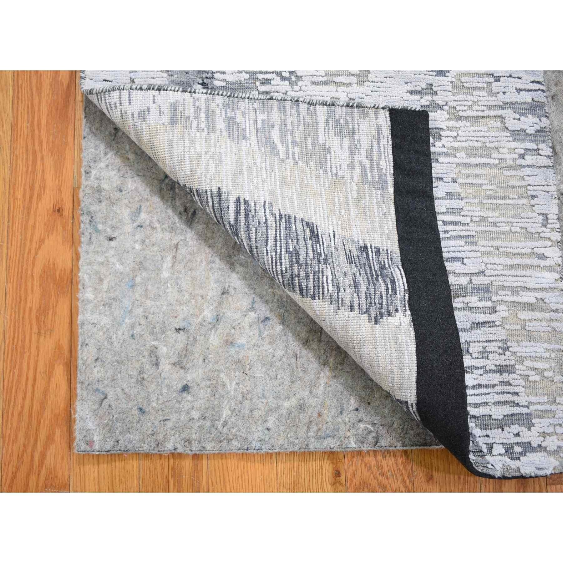 This is a truly genuine one-of-a-kind DIMENSIONAL CURTAINS Gray Silk With Textured Wool Oriental Rug. It has been Knotted for months and months in the centuries-old Persian weaving craftsmanship techniques by expert artisans.
Primary materials: Wool