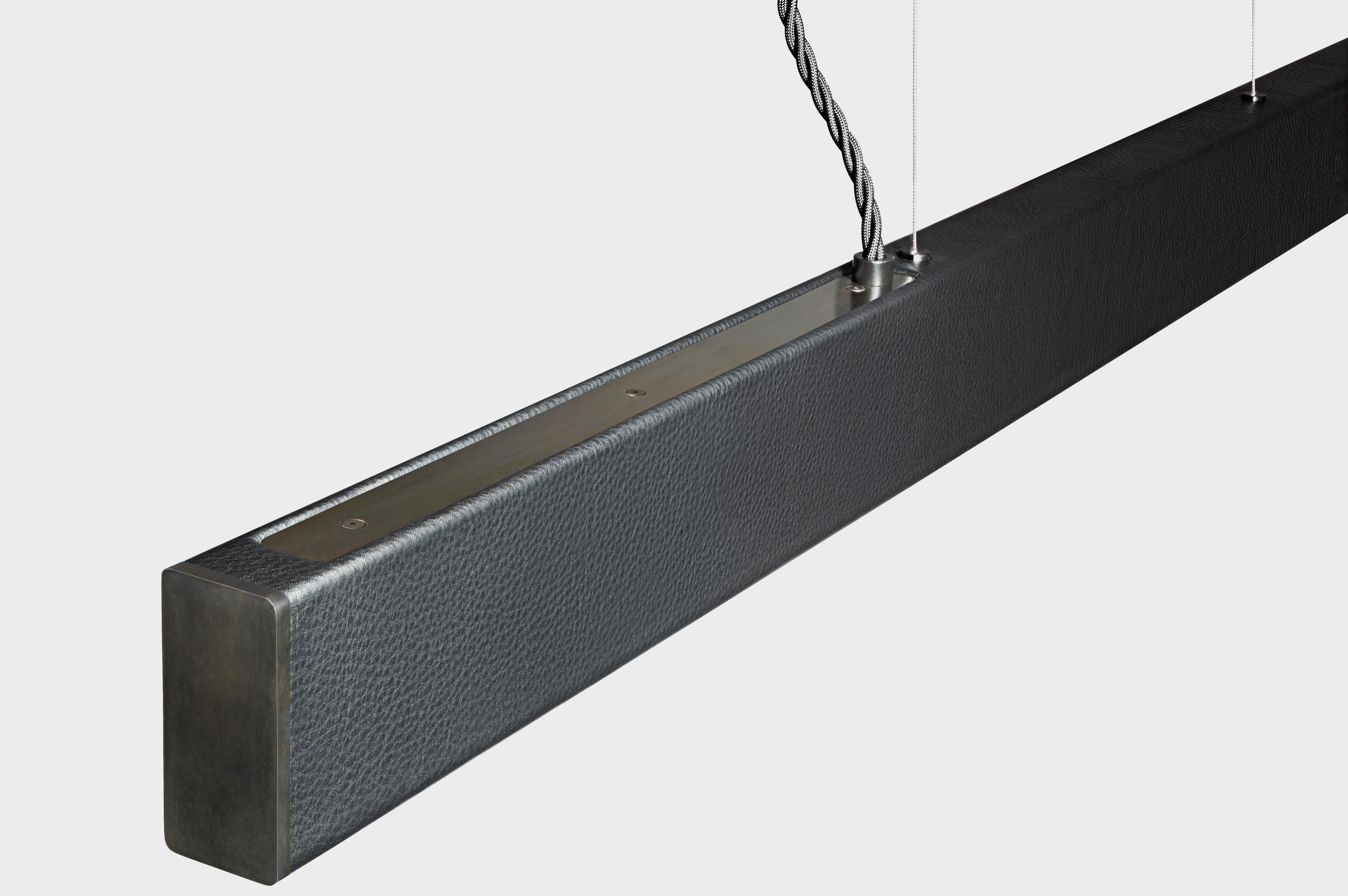 Remaining true to its roots while embracing new materials, the Leather 2x4 is a reimagining of our signature 2x4 Pendant. The classic metal hardware is accentuated by lush hand cut leather finishes, creating a sophisticated pendant that draws the