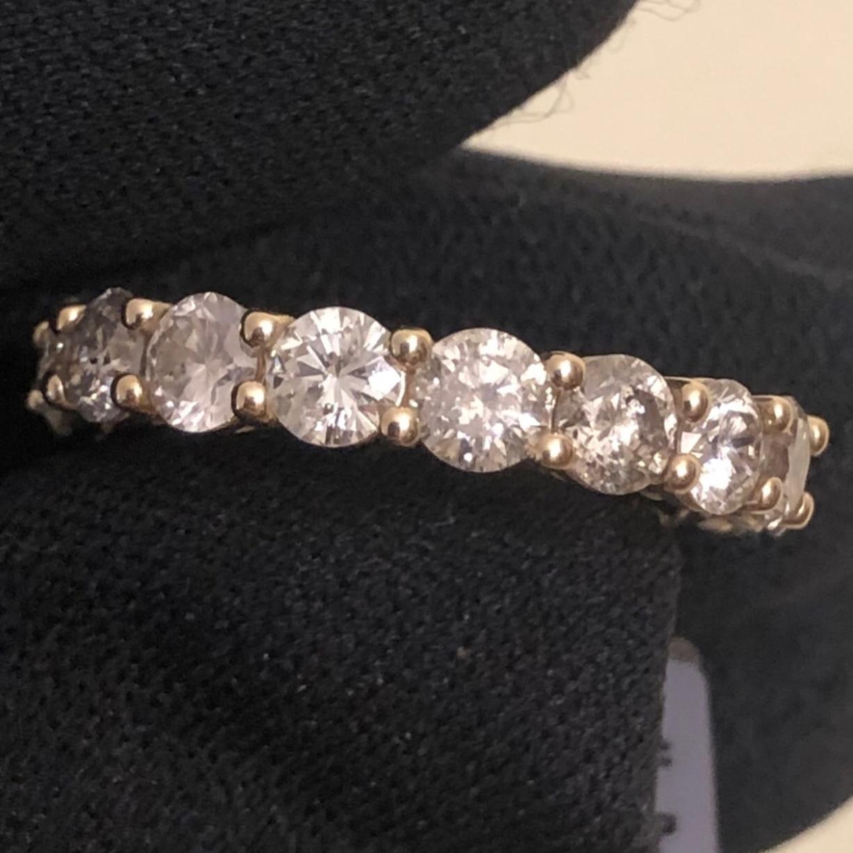 Stunning 3 1/2 carat round diamond full eternity band ring in 14k yellow gold. 17 round SI-I clarity solitaire diamonds are hand set in this full eternity band weighing approx. 3.53 carats.


17 natural 1/5 carat solitaire earth-mined diamonds are