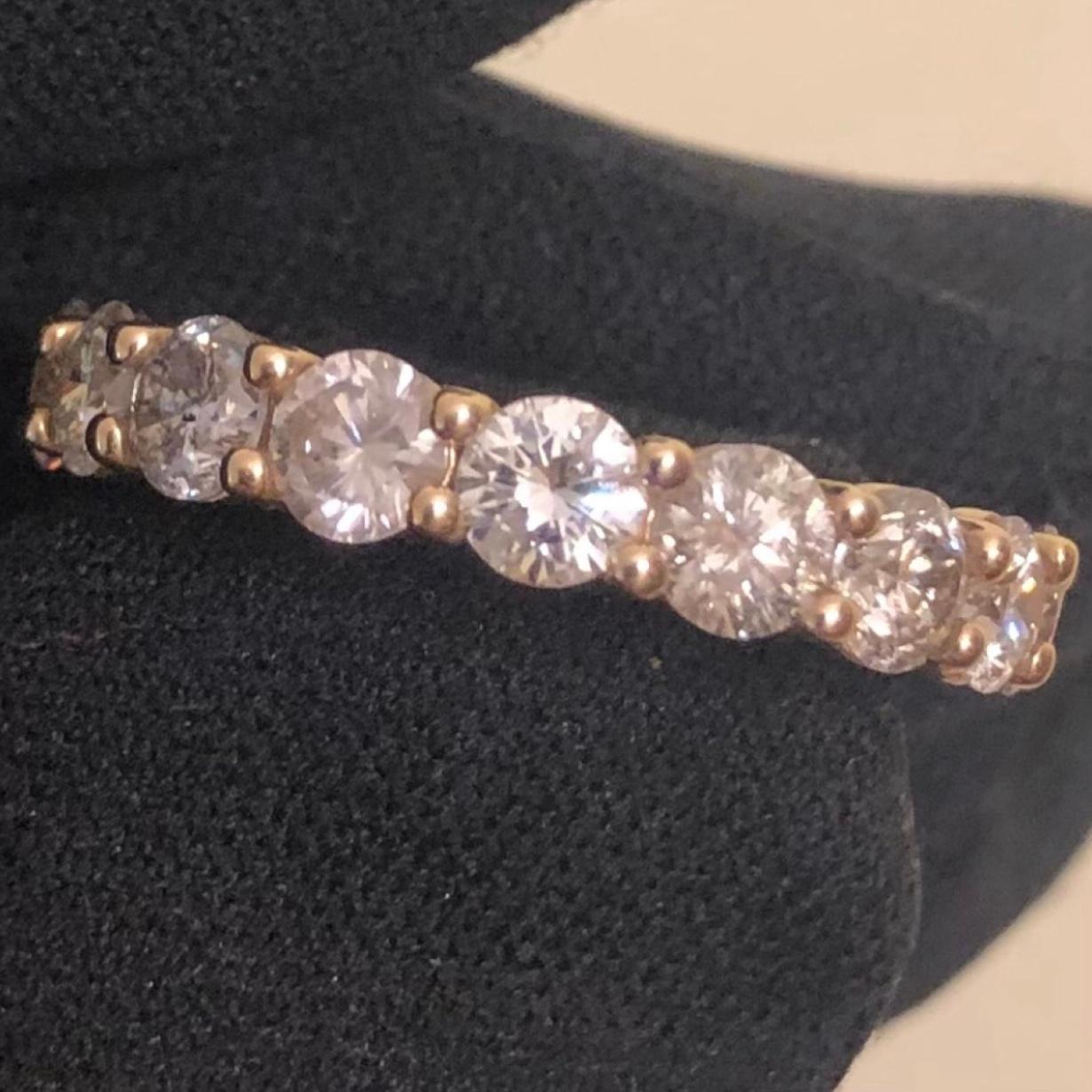 Stunning 3 1/2 carat round diamond full eternity band ring in 14k yellow gold. 17 round SI-I clarity solitaire diamonds are hand set in this full eternity band weighing approx. 3.53 carats.


17 natural 1/5 carat solitaire earth-mined diamonds are