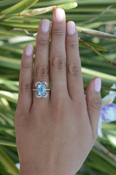 Vintage Emerald Cut Aquamarine Alhambra Engagement Ring