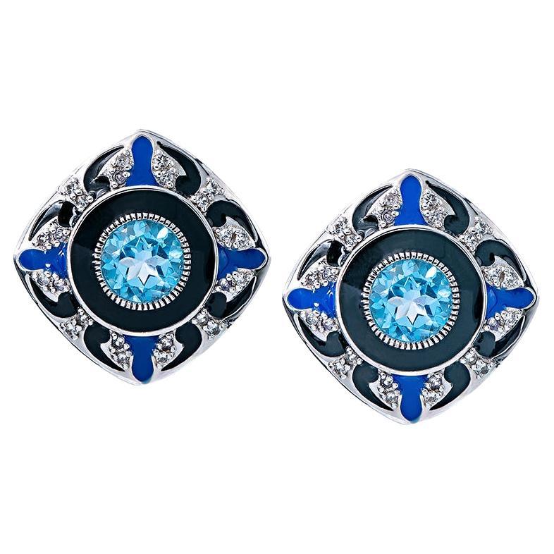 These exquisite earrings are made from high-quality sterling silver. Adorned with a captivating round Swiss blue topaz and complemented by round white topaz, they exude timeless beauty. The addition of black and blue enamel with a milgrain finish