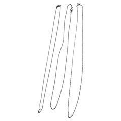 3 chaînes en or blanc 14k et 2 chaînes en or jaune 14k