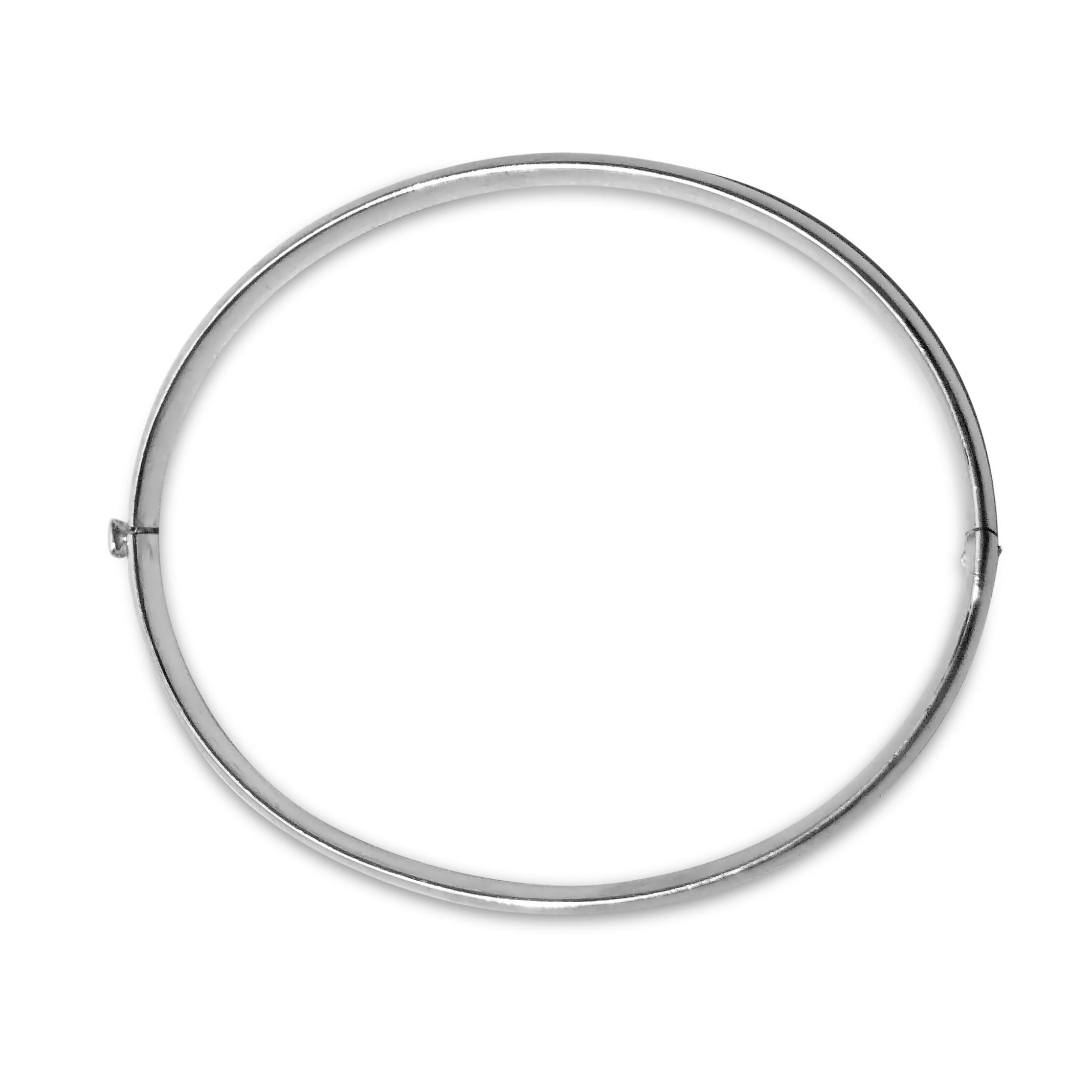A perfectly classic silver bangle. Our ‘Dome Bright’ .925 sterling silver oval-shaped bracelet is 3/16 inches in width and securely closes with a snap & hinge.

Specifications:
- Shape: Oval
- Metal(s): Silver
- Dimension: 6 5/8