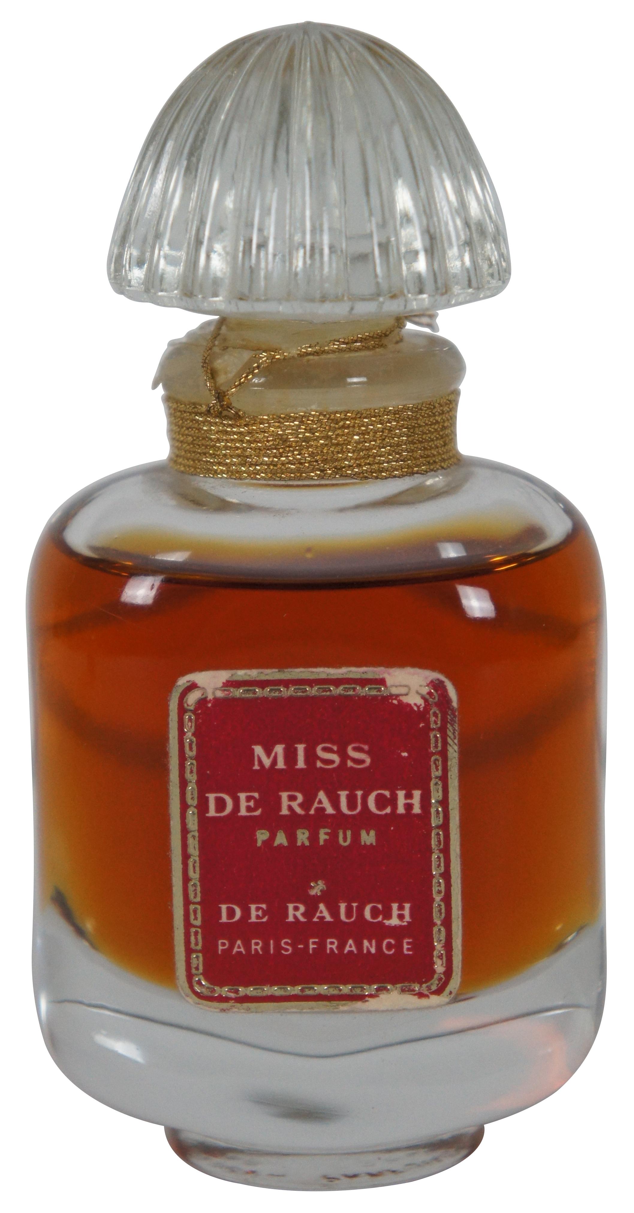 Lot of three vintage 1960s perfumes – Miss De Rauch by De Rauch, Asghar Ali & Sons version of Yves Saint Laurent, and Femme by Marcel Rochas.

Measures: Miss de Rauch - 1.75” x 1.25” x 3.675” / Asghar Ali - 1” x 1” x 2.5” / Femme - 1.25” x 0.75” x