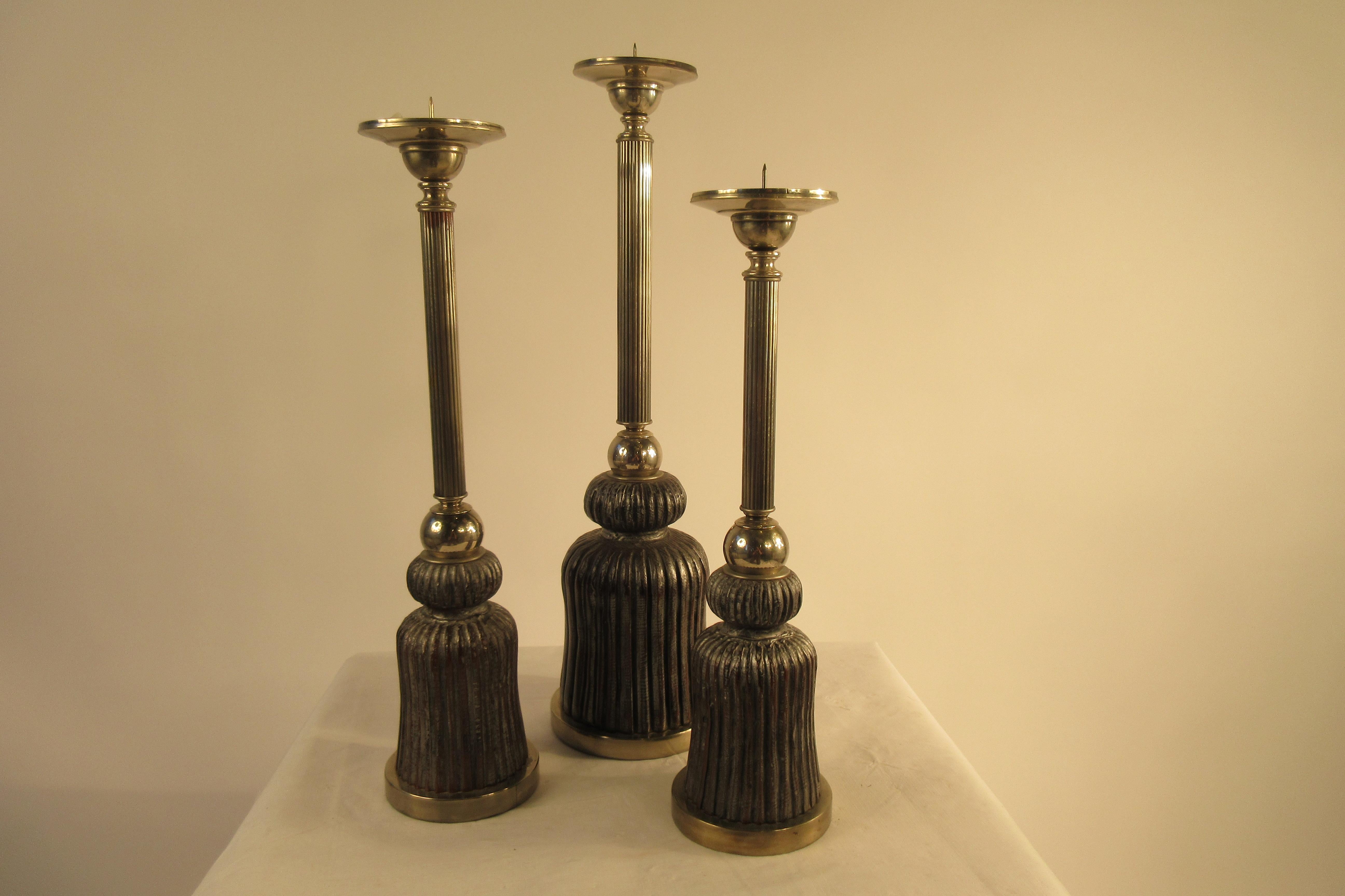 3 1980s silver plate and wood tassel candlesticks. Each a different height.