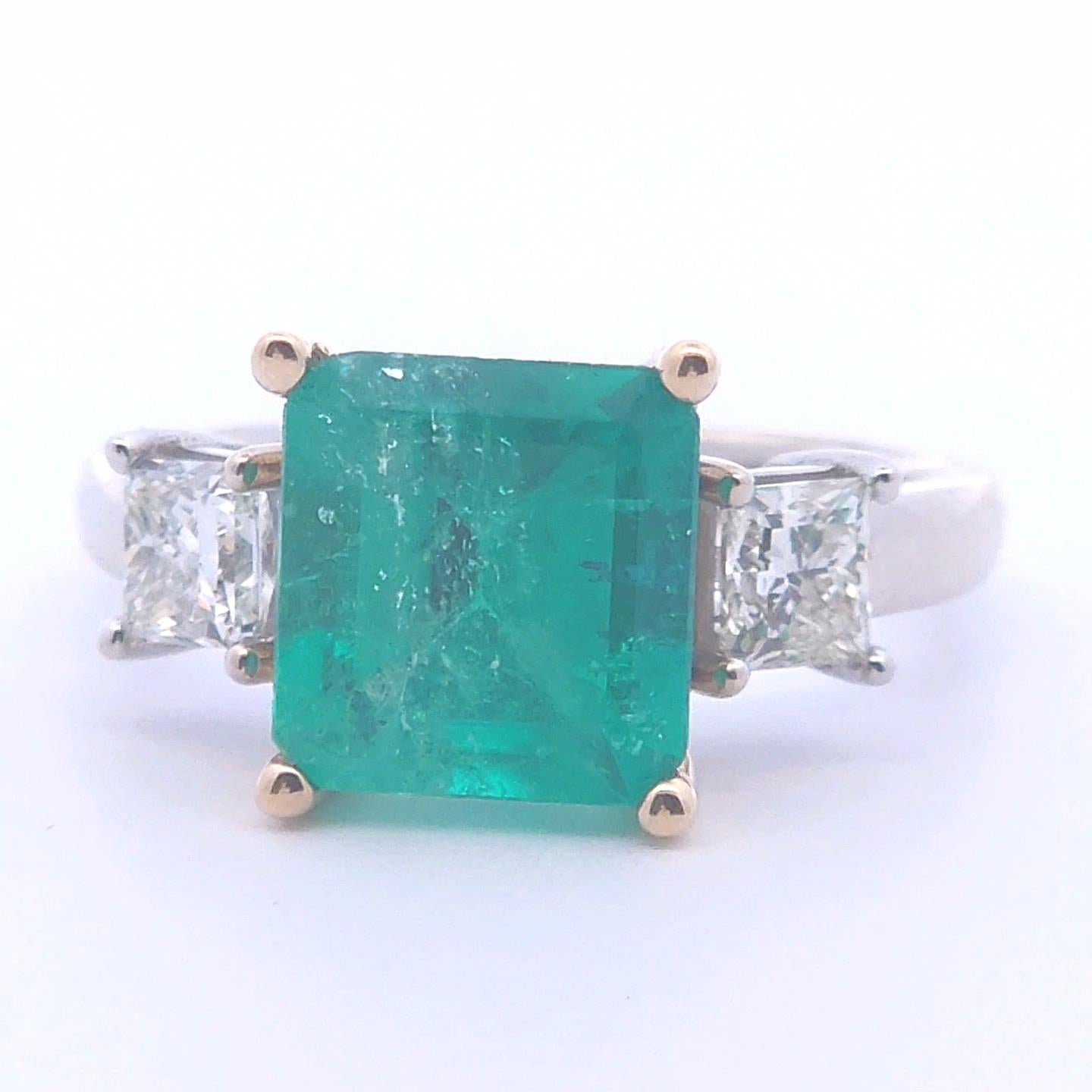 This stunning 3 3/4 carat emerald ring in 14K gold is a timeless treasure, radiating elegance and luxury. The rich green emerald is masterfully cut, allowing its natural beauty to shine with every glint of light. Set in a classic 14K gold band, the