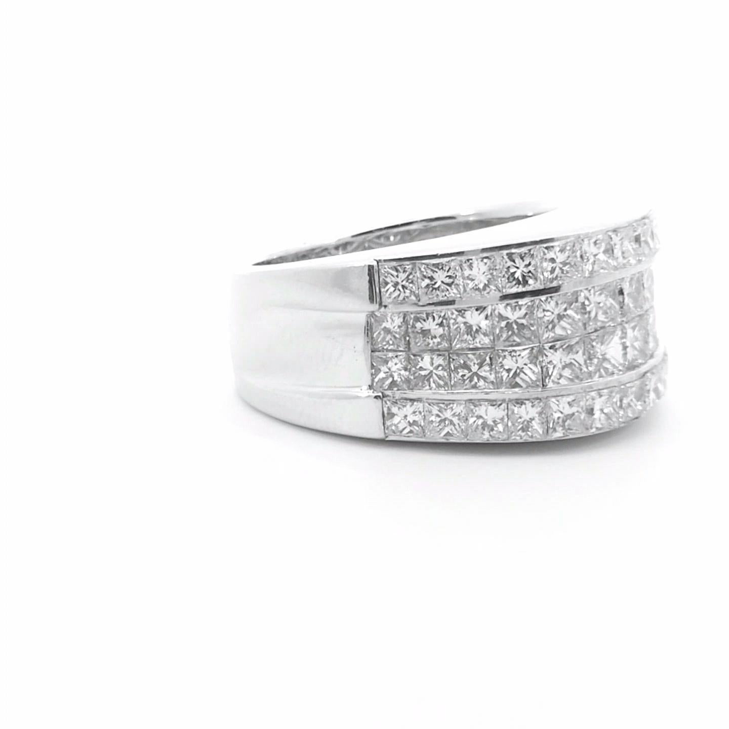 Indulge in timeless elegance with our exquisite 3.76 ct Invisible Set Anniversary Ring, a true masterpiece of craftsmanship and design.

Expertly crafted in 18K gold, this stunning ring features a seamless arrangement of Princess-cut diamonds,