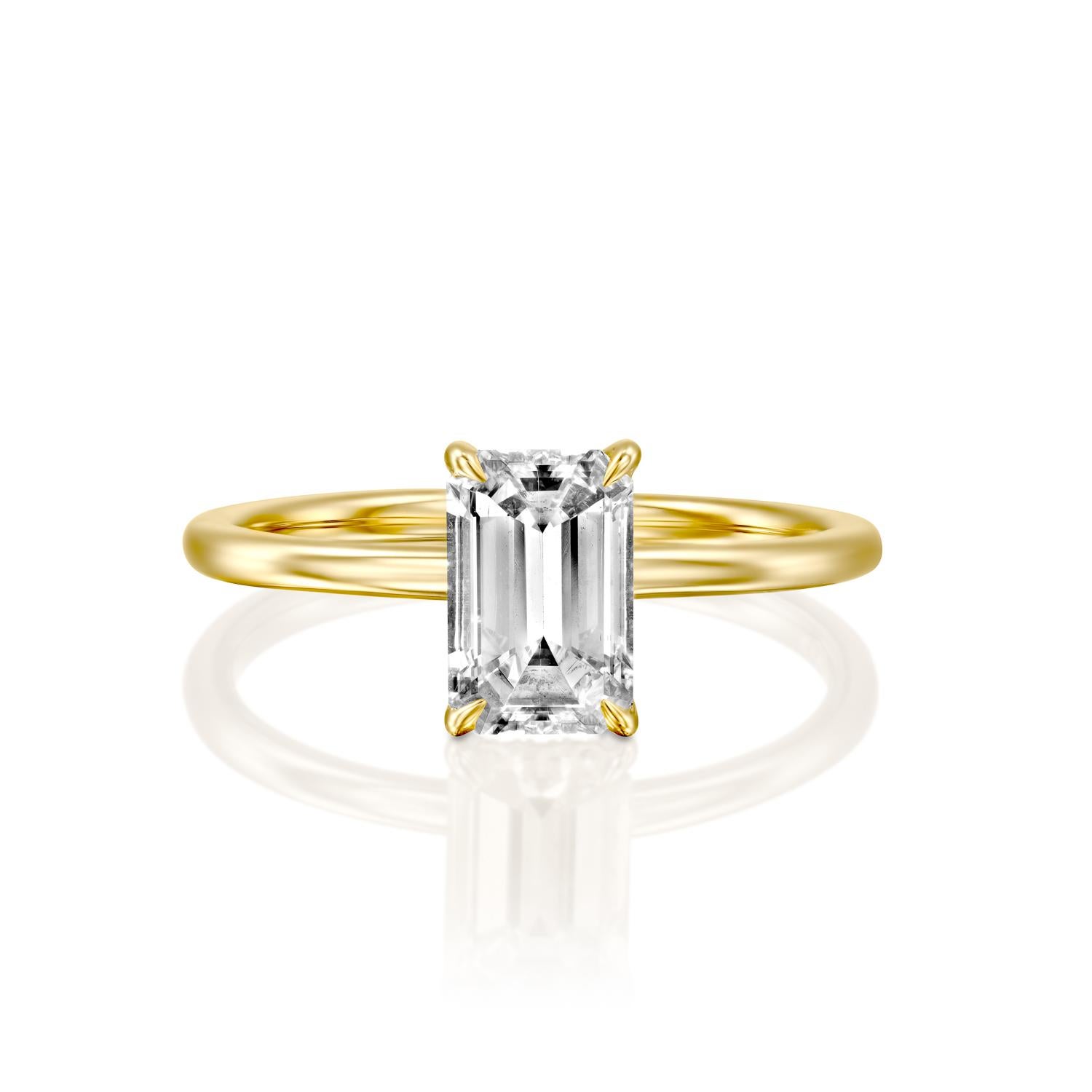This breathtaking ring features a solitaire GIA certified diamond. Ring features a 3/4 carat emerald cut 100% eye clean natural diamond of F-G color and VS2-SI1 clarity. Set in a sleek, 18K yellow gold, solitaire ring with a 4-prong setting, this