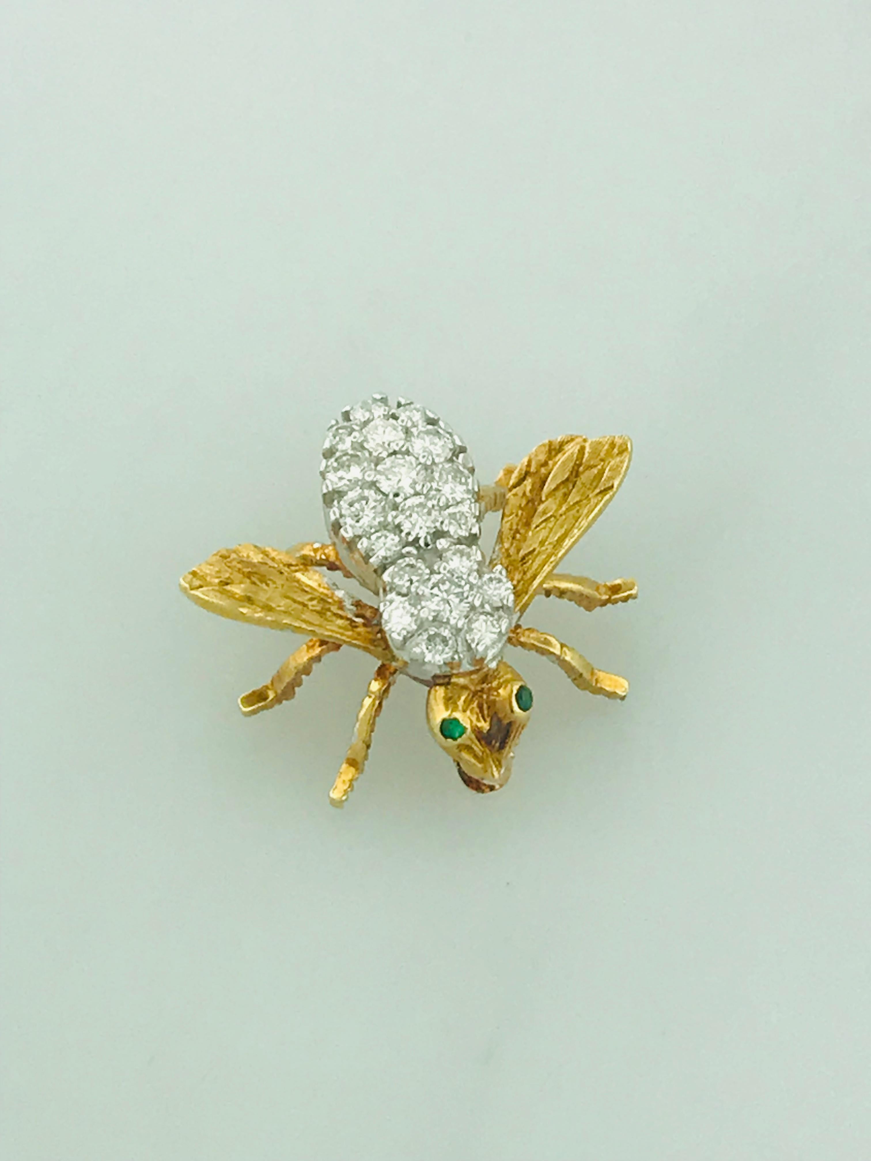 This adorable honey bee pin is paved in genuine natural round brilliant diamonds. There is a total of .65 carats total diamond weight. The diamonds are top quality, VS clarity and E-F Color! The eyes of the bee are made out of genuine emerald