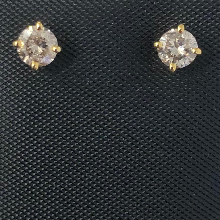 Classic approx. 3/5 ct solitaire diamond stud earrings in 14k yellow gold. Pair of natural earth-mined round brilliant diamonds weighing approx. 3/5 carat are prong set in these 14K gold basket studs.

Diamond stud earrings come with solid 14k gold