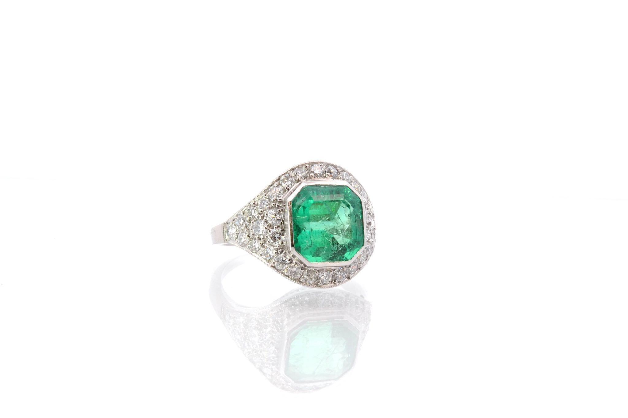 Emerald Cut 3, 56 cts emerald and diamonds ring in platinum For Sale