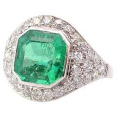 3, 56 cts anillo de esmeralda y diamantes en platino
