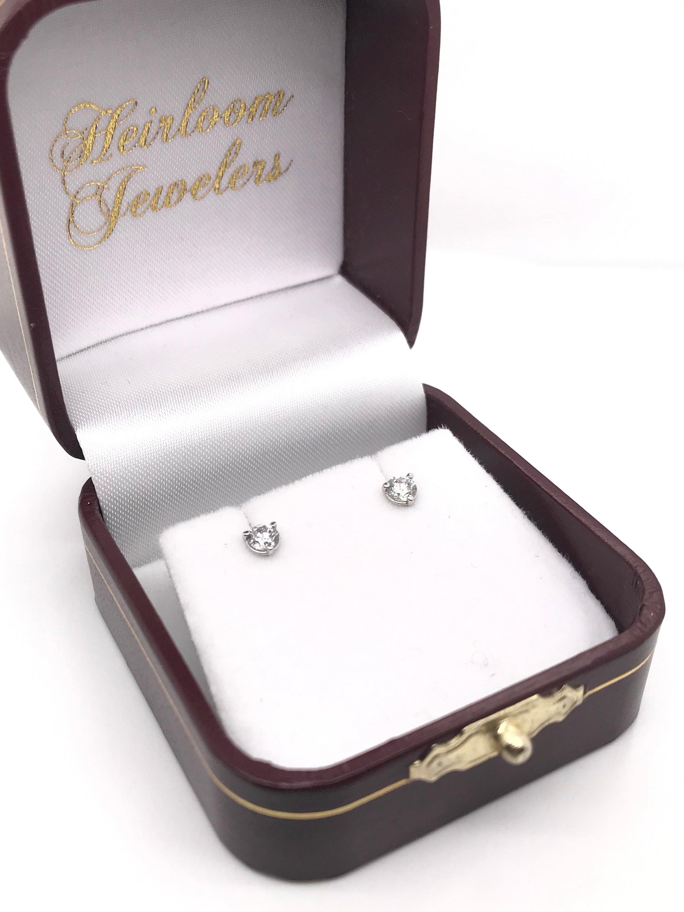 These contemporary style diamond earrings feature approximately 0.38 carats of diamonds; combined total weight. The settings are 14k white gold and are 