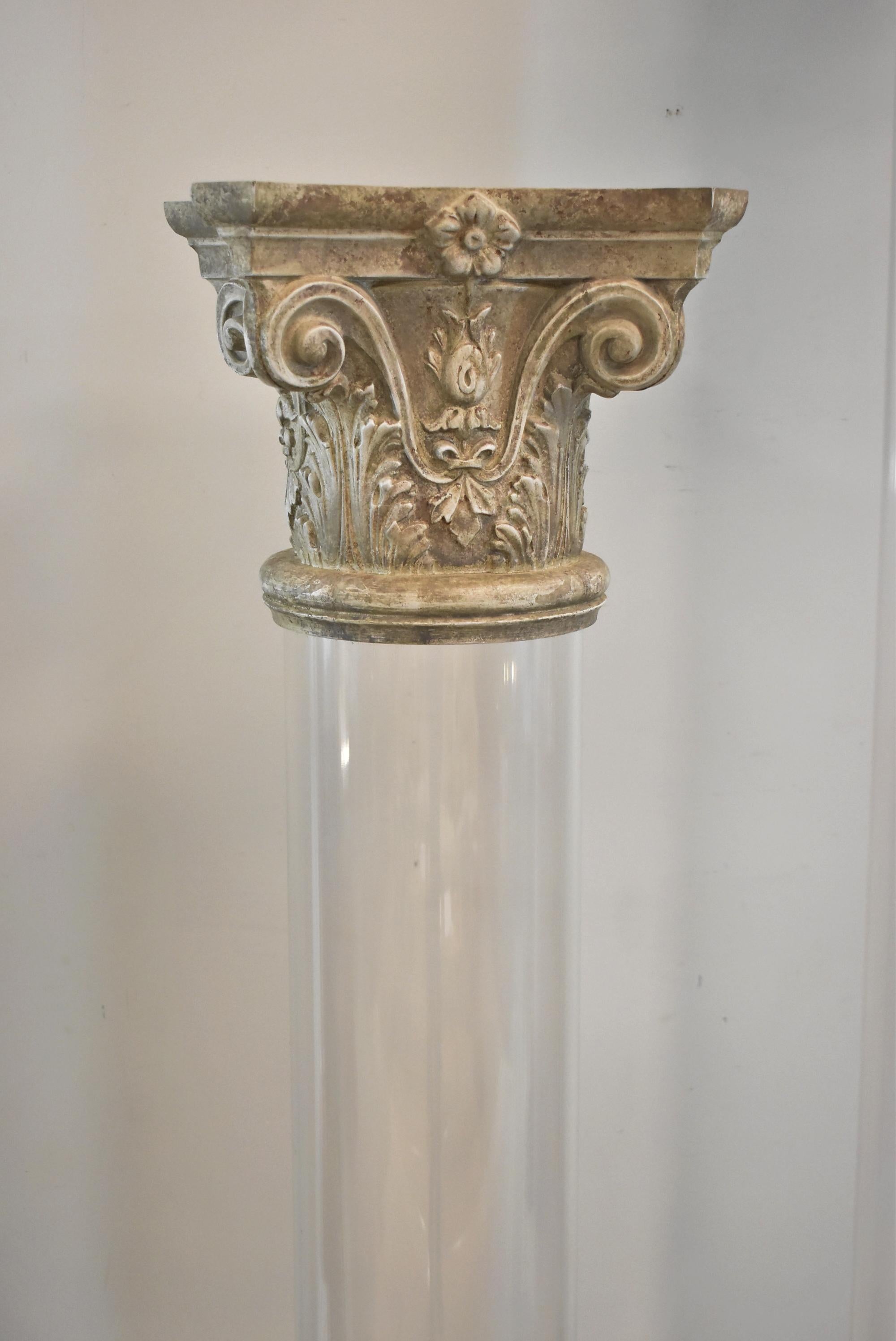 3 Acrylic Pillars with Corinthian tops. A late 20th-century pedestal column made of acrylic and limestone. The base is made of clear acrylic with some scuffing. The top half of the column is ornately and exquisitely carved limestone. The limestone