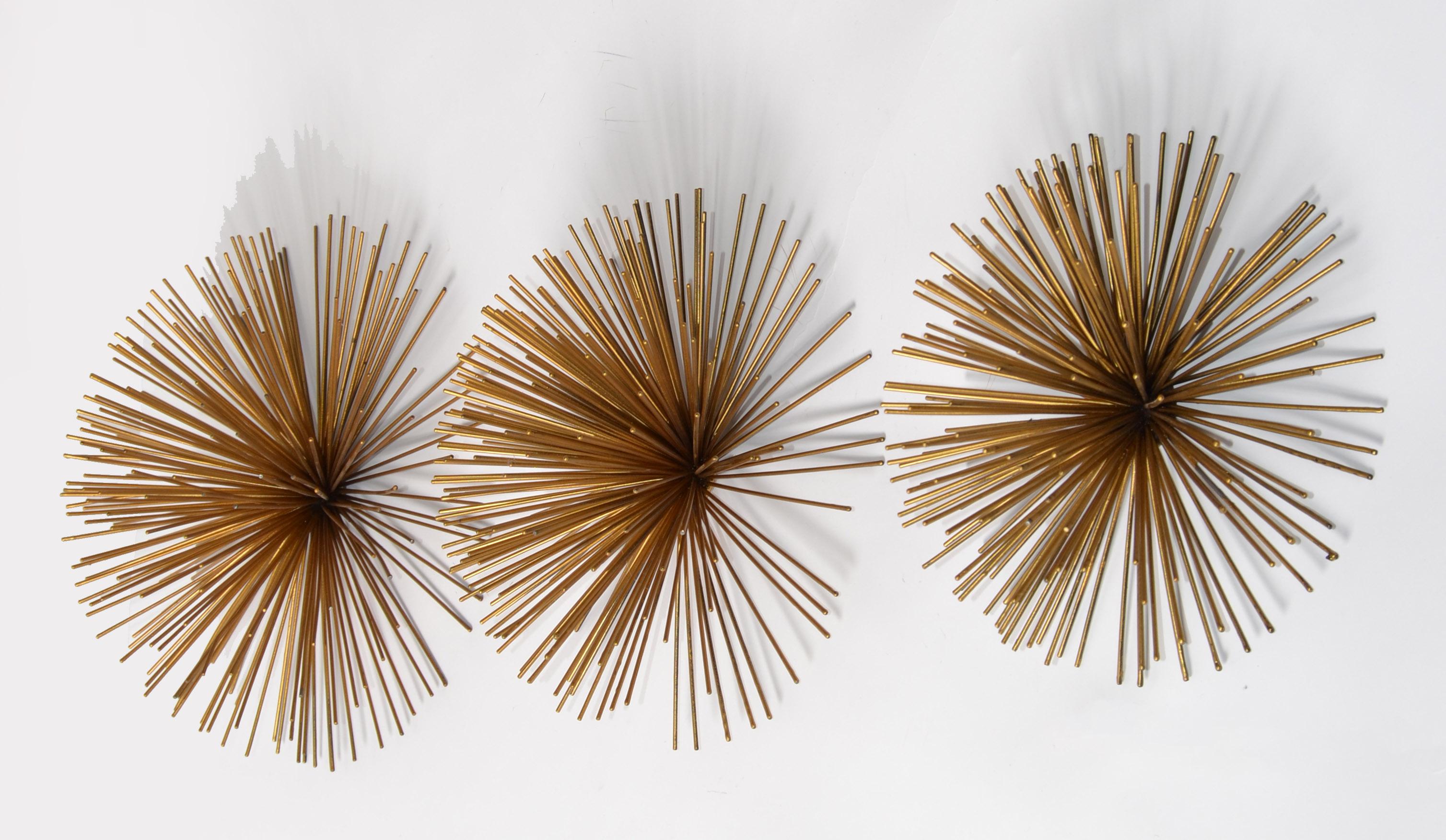 Mid-Century Modern funky 3 Pieces Steel Pom Pom Wall Art in Brass Finish and black painted Wall Sculpture in the Style of Curtis Jeré.
American Metal Art with a touch of Designer Harry Bertoia, combines the kinetic movement of the sounding