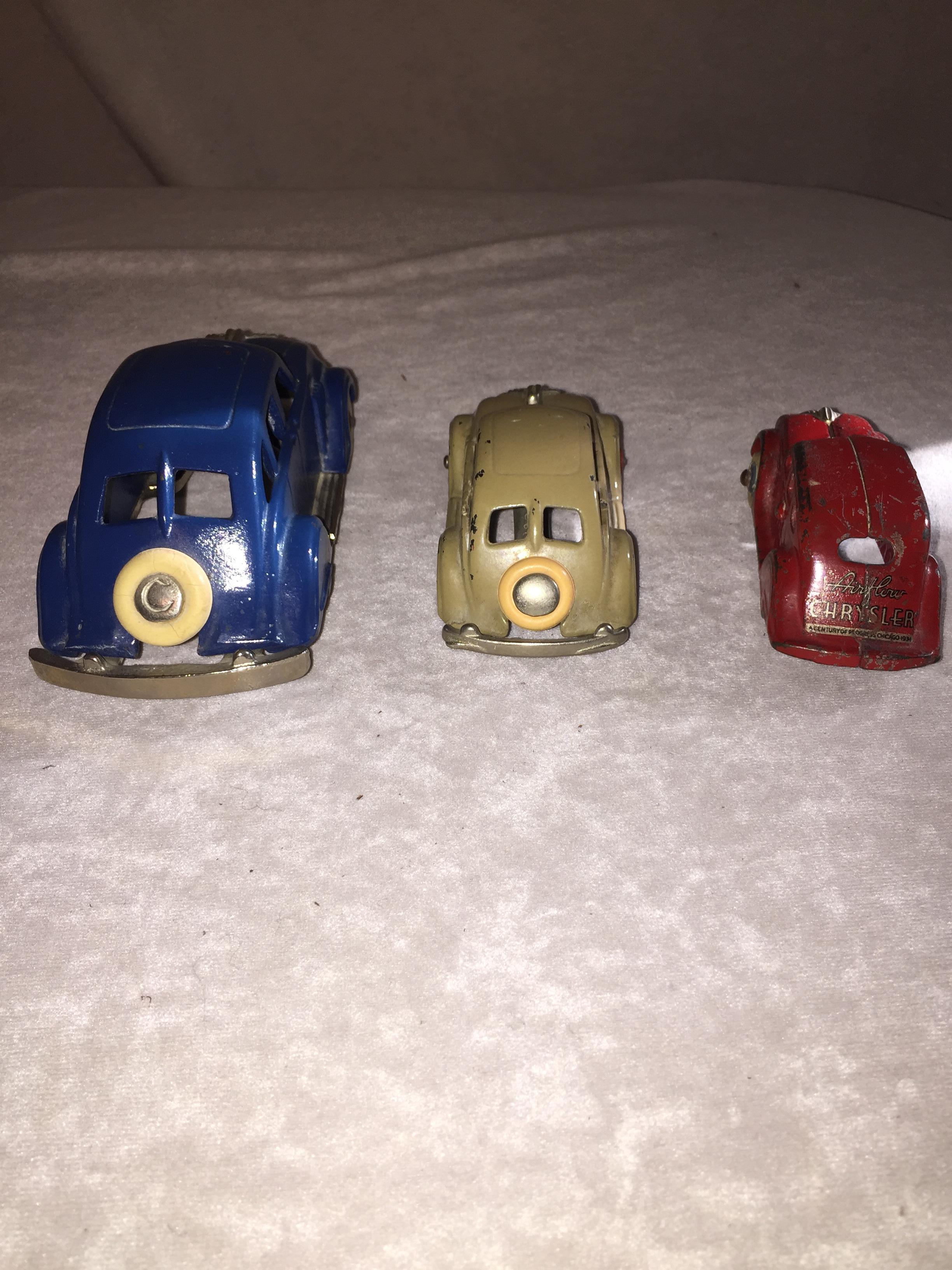 Three very fun cast iron cars signed by the premier maker of cast iron, Hubley. These are circa 1930 and are just beautiful to look at and play with. 
 We have only listed the measurements of the big blue car, as you can easily where the others