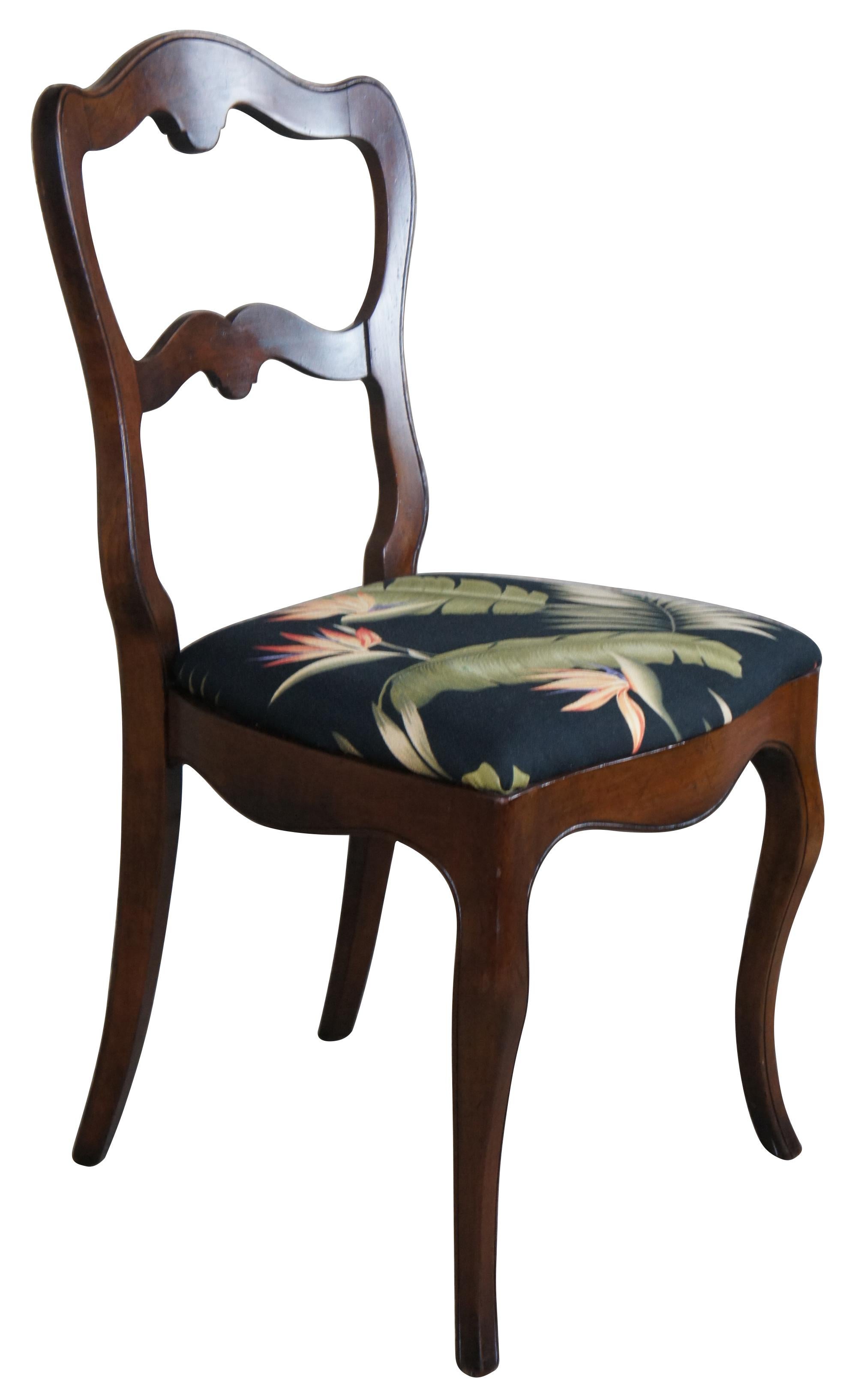 Set of 3 late 19th century dining or side chairs. Made from walnut with a serpentine back, tropical fabric and cabriole legs.