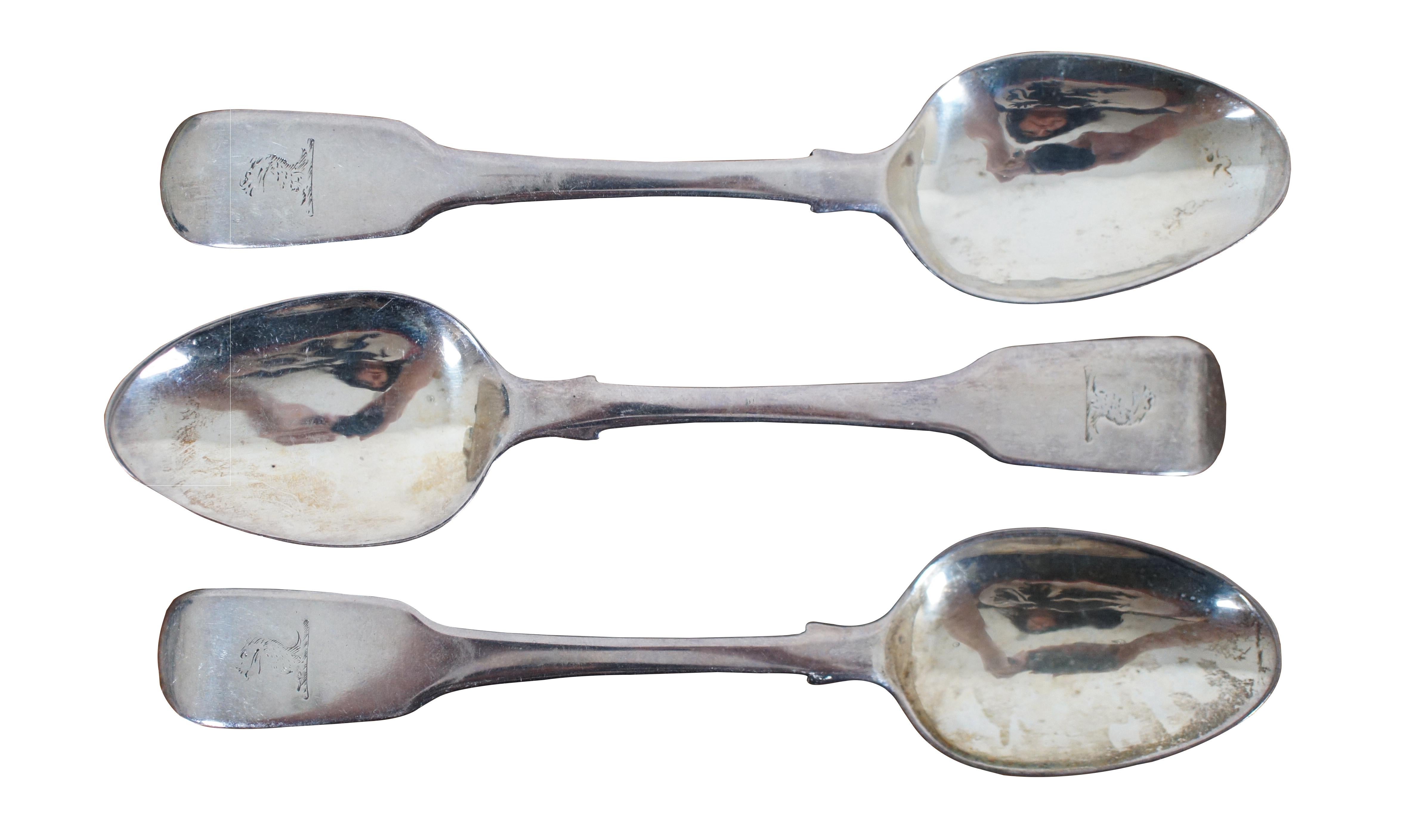 Set of three antique early 19th century sterling silver teaspoons with tipped fiddle shaped handles, engraved with the head of a sea serpent or dragon; made in 1821 by William Bateman I of London.

