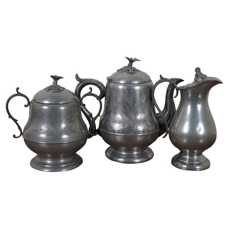 https://a.1stdibscdn.com/3-antique-h-homan-co-pewter-tea-coffee-teapot-sugar-bowl-creamer-10-for-sale/f_53432/f_308049021665495240998/f_30804902_1665495243091_bg_processed.jpg?width=768