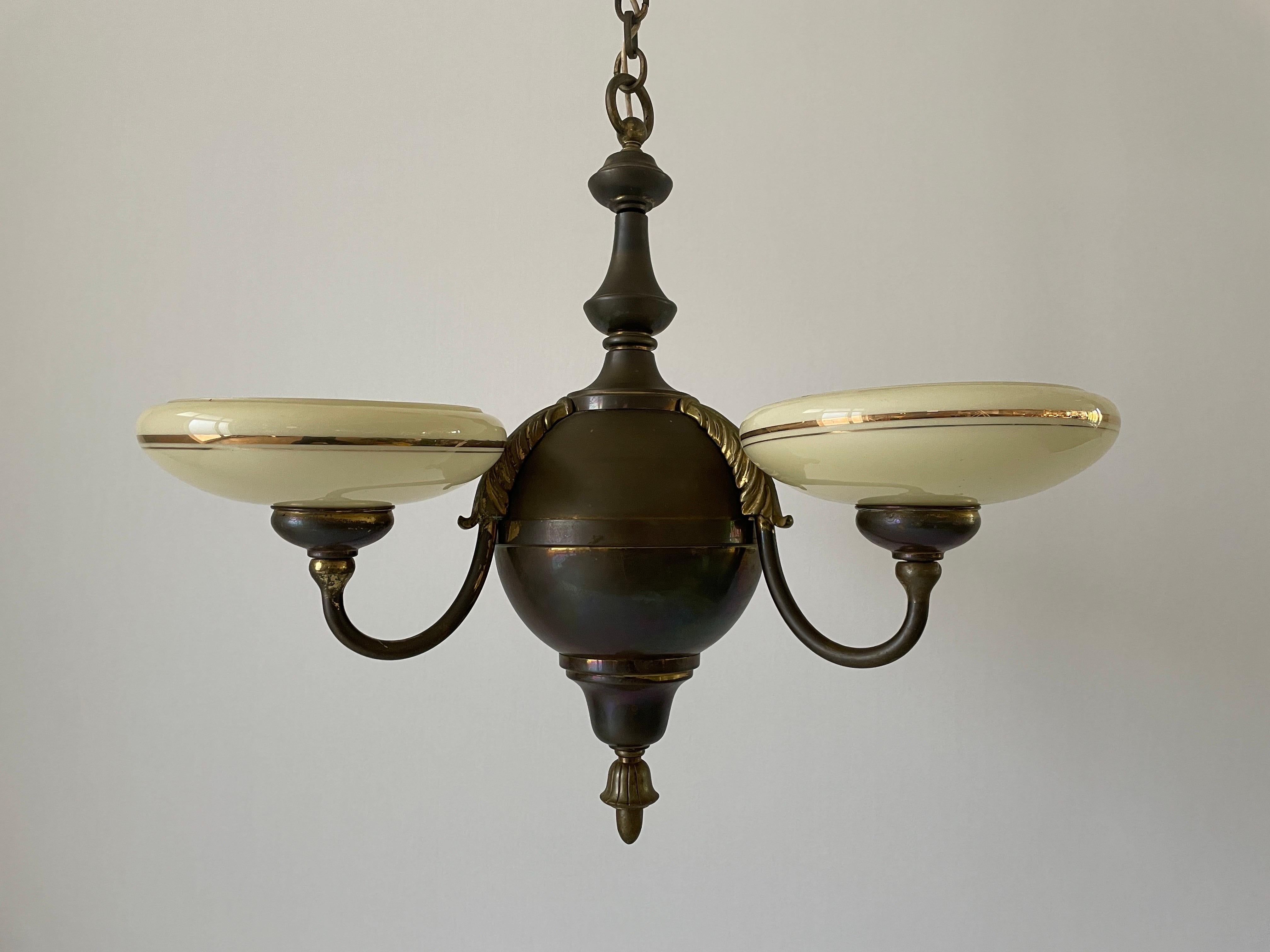 3-armed Glass and Brass Art Deco Chandelier, 1940s, Germany

Lampshade is in very good vintage condition.

This lamp works with 3x E27 light bulbs. 
Wired and suitable to use with 220V and 110V for all countries.

Measurements: 
Height: 80 cm
Shade
