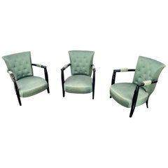 3 Sillones Art Decó de madera ennegrecida, hacia 1940