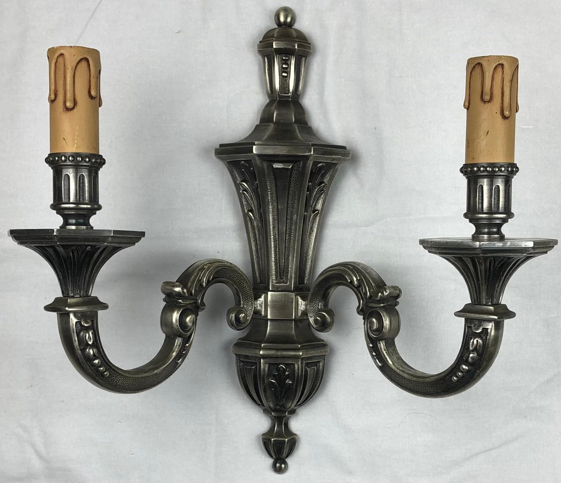 Set of 3 French Art Deco or Hollywood Regency silvered bronze two arm wall sconces in perfect vintage condition. 

Beautiful decorative design, electrified.
Very good quality and well cast. Stamped.

Measures: 13 1/8