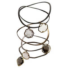 3 Bangles in silver and gold with smoky quartz, rock crystal &  pink quartz