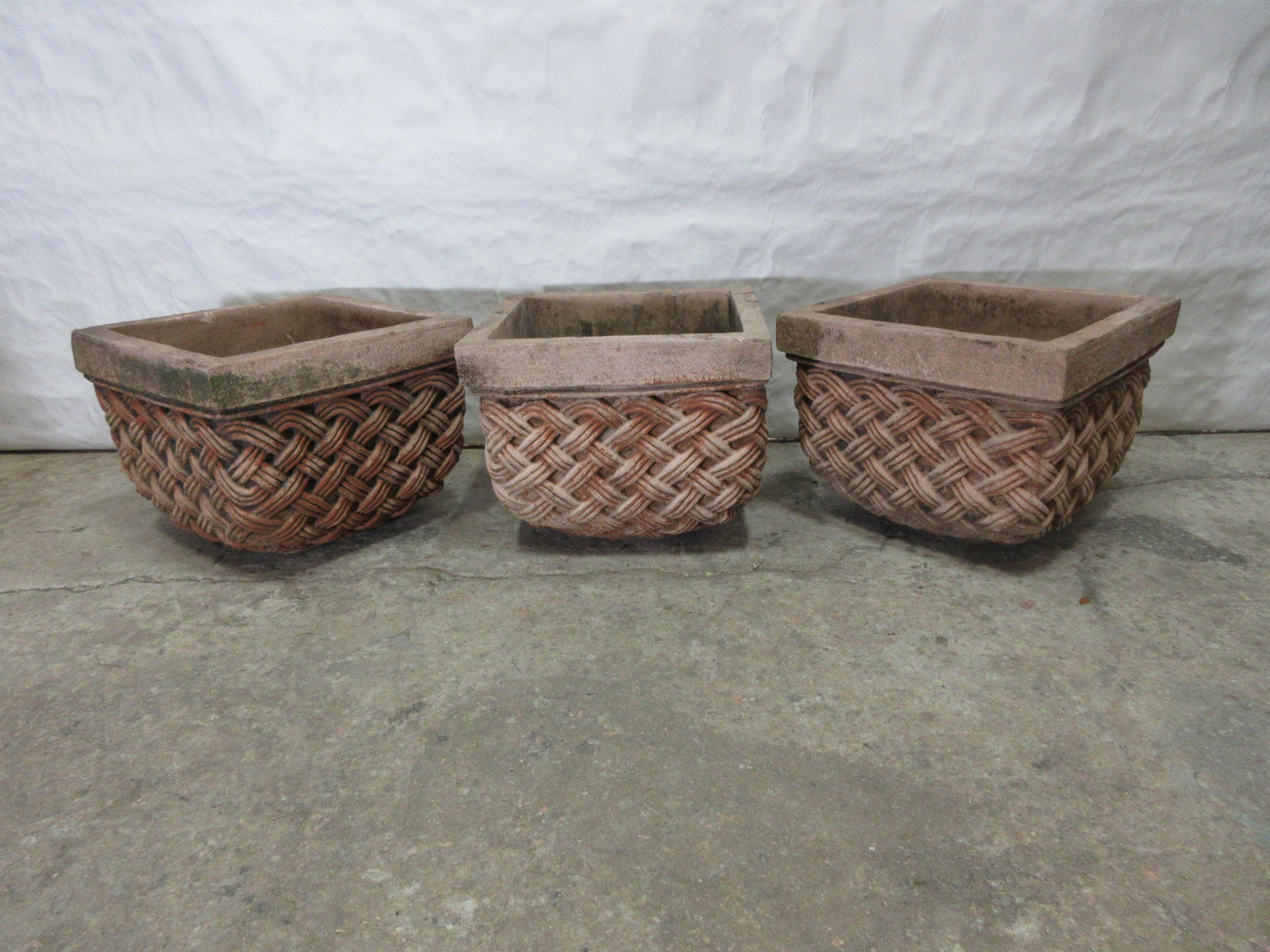 This is an original finish set of 3 basket weave planters.