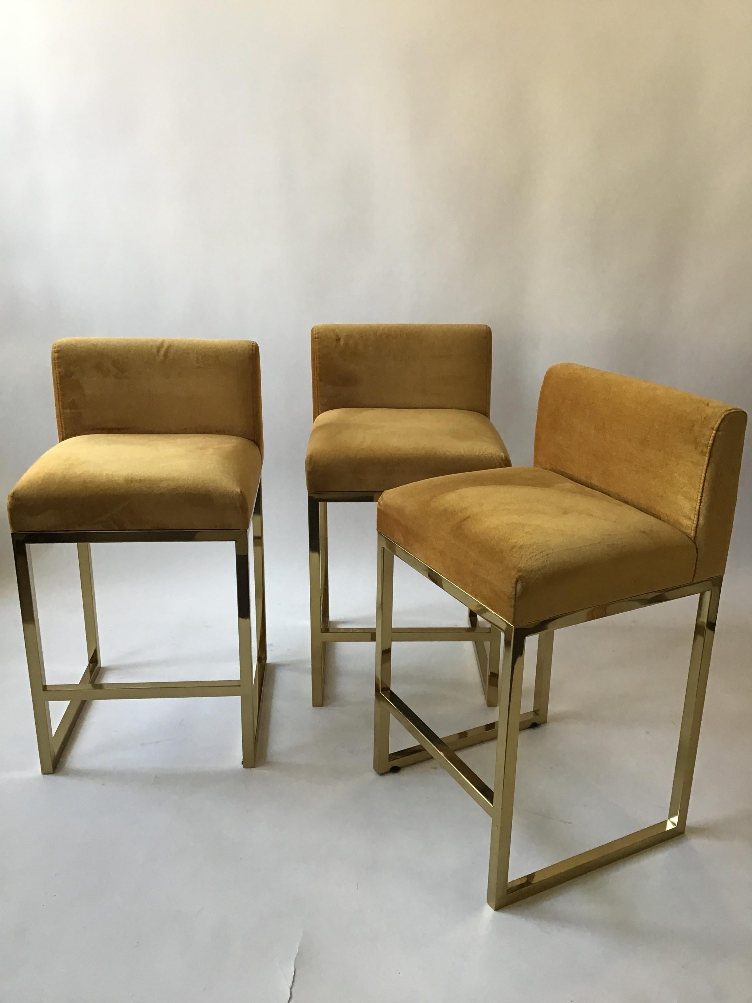 3 brass plated bar and counter stools. Height is 34.