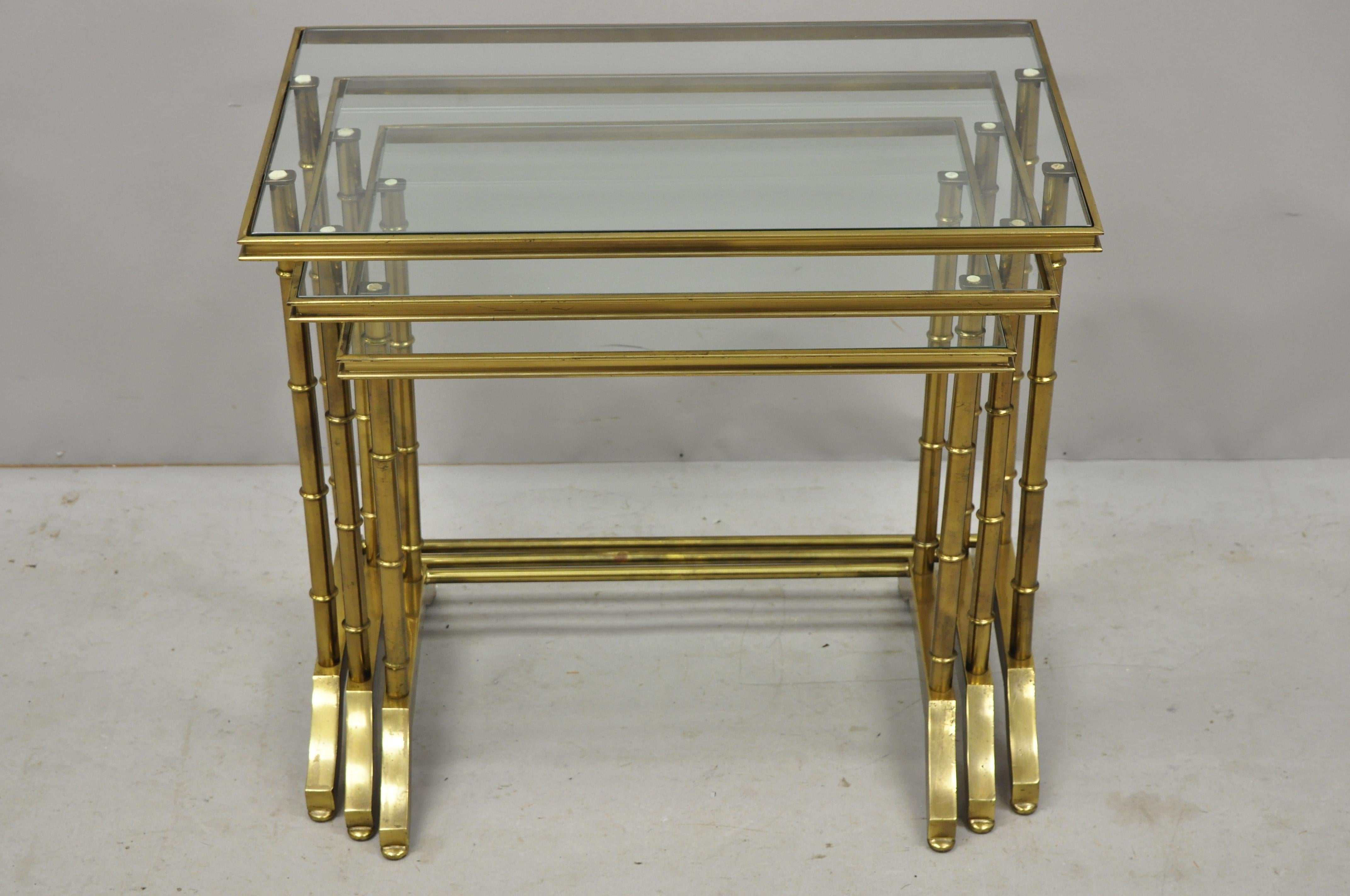 3 brass faux bamboo glass top nesting side tables attributed to Mastercraft. Listing features a faux bamboo design, glass tops, nesting form, brass construction, quality craftsmanship, great style and form. Attributed to Mastercraft, circa mid-20th