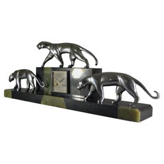 3 bronze panthers on large art deco clock. Michel decoux sculpture