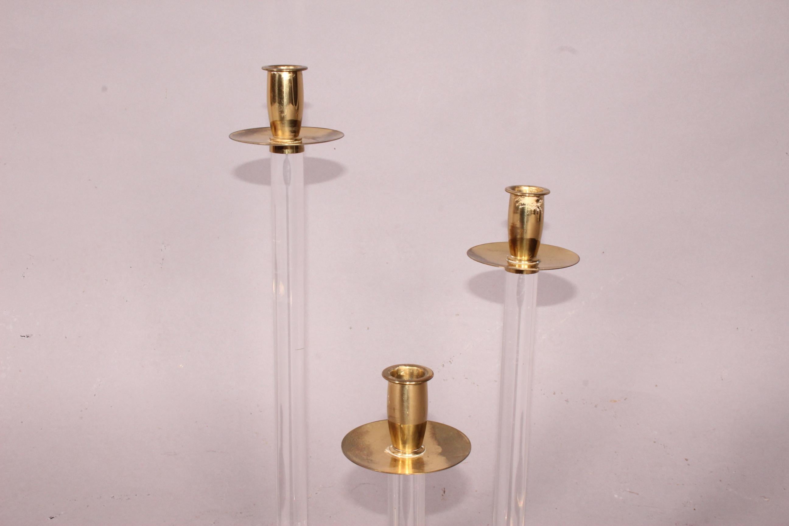 3 candlestick brass and plexiglass.