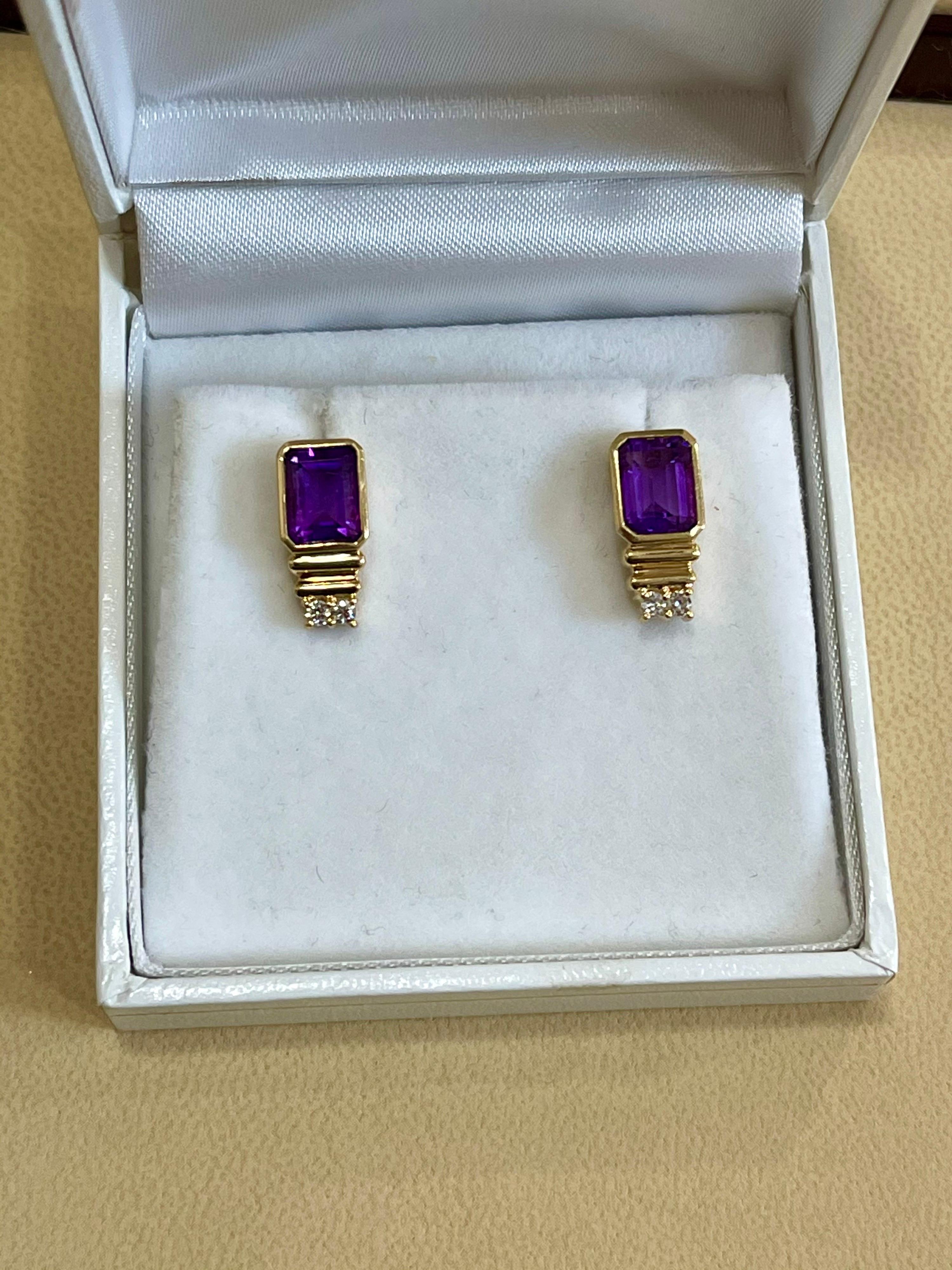 3 Carat Emerald cut  Amethyst and Diamond 14 Karat Yellow Gold Earrings, Stud Post Earring
Beautiful pair of earrings  finely crafted in  14 Karat  solid Yellow gold.
9 X 7 emerald cut stone
Very desirable color and quality.
perfect pair made in 14