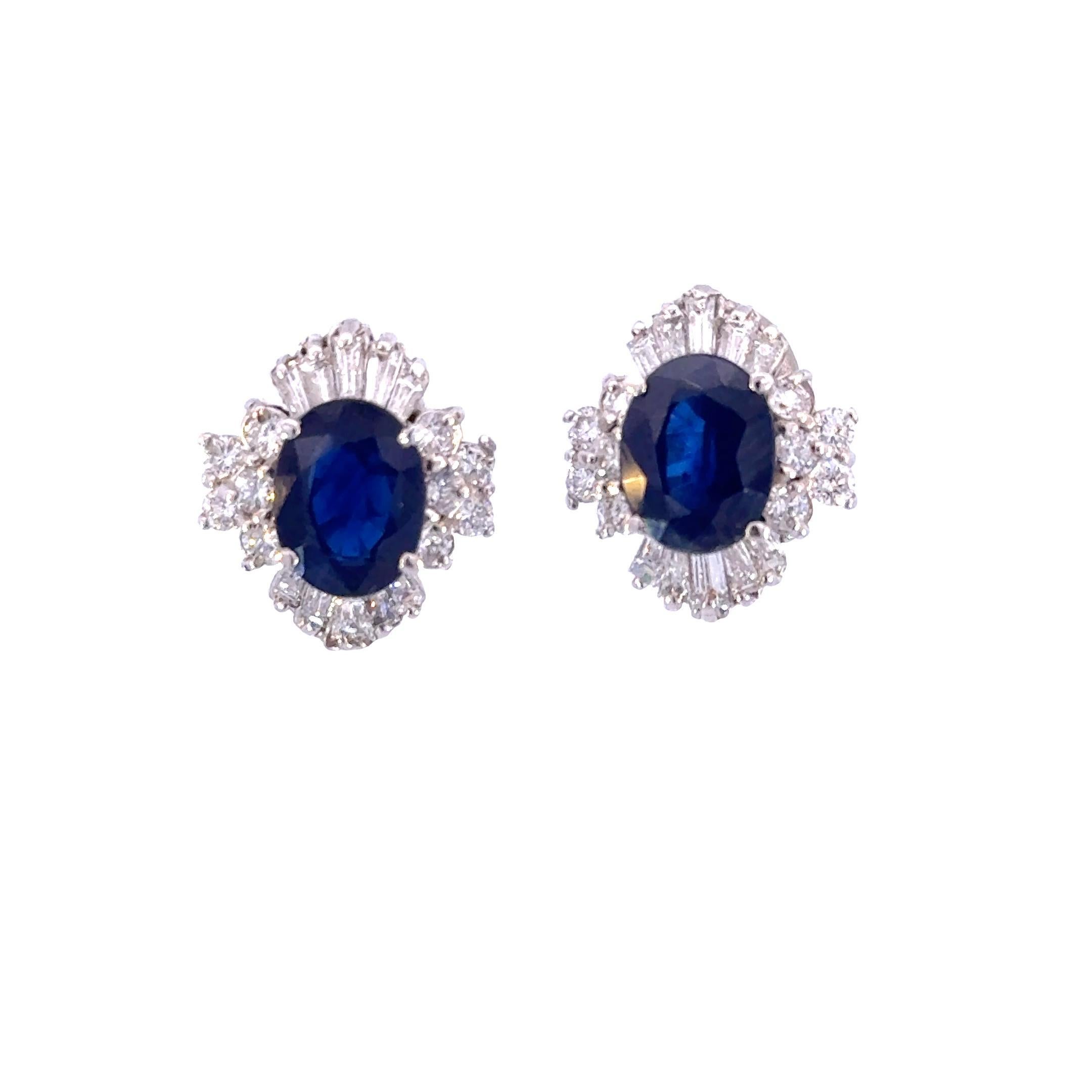 The jewelry creation showcases exquisite stud earrings featuring a captivating blue sapphire at the center, weighing 3.0 carats. Encircled by 1.0 carat of white diamonds, these stones exhibit a clarity of VS2 and a color grade of F. Crafted from 18k